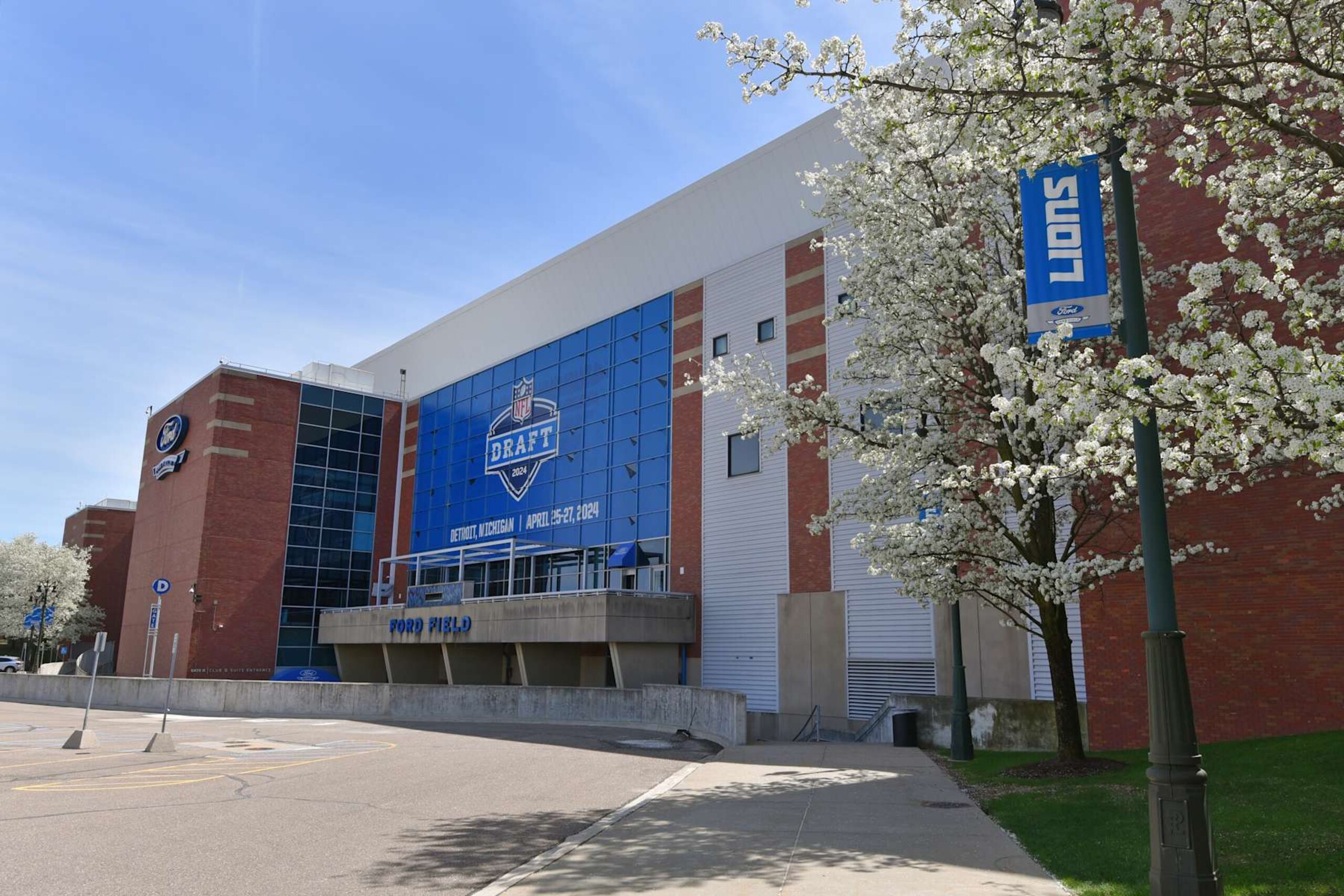 DETROIT, MI - APRIL 18:  A general exterior view of Ford Field, home of the NFL Detroit Lions, with a sign displayed to announce the upcoming NFL draft. The draft is scheduled to be held around Campus Martius Park and Hart Plaza in Detroit, Michigan on April 25Â27, 2024. Photo taken prior to the MLB game between the Detroit Tigers and the Texas Rangers at Comerica Park on April 18, 2024 in Detroit, Michigan.  (Photo by Mark Cunningham/MLB Photos via Getty Images)