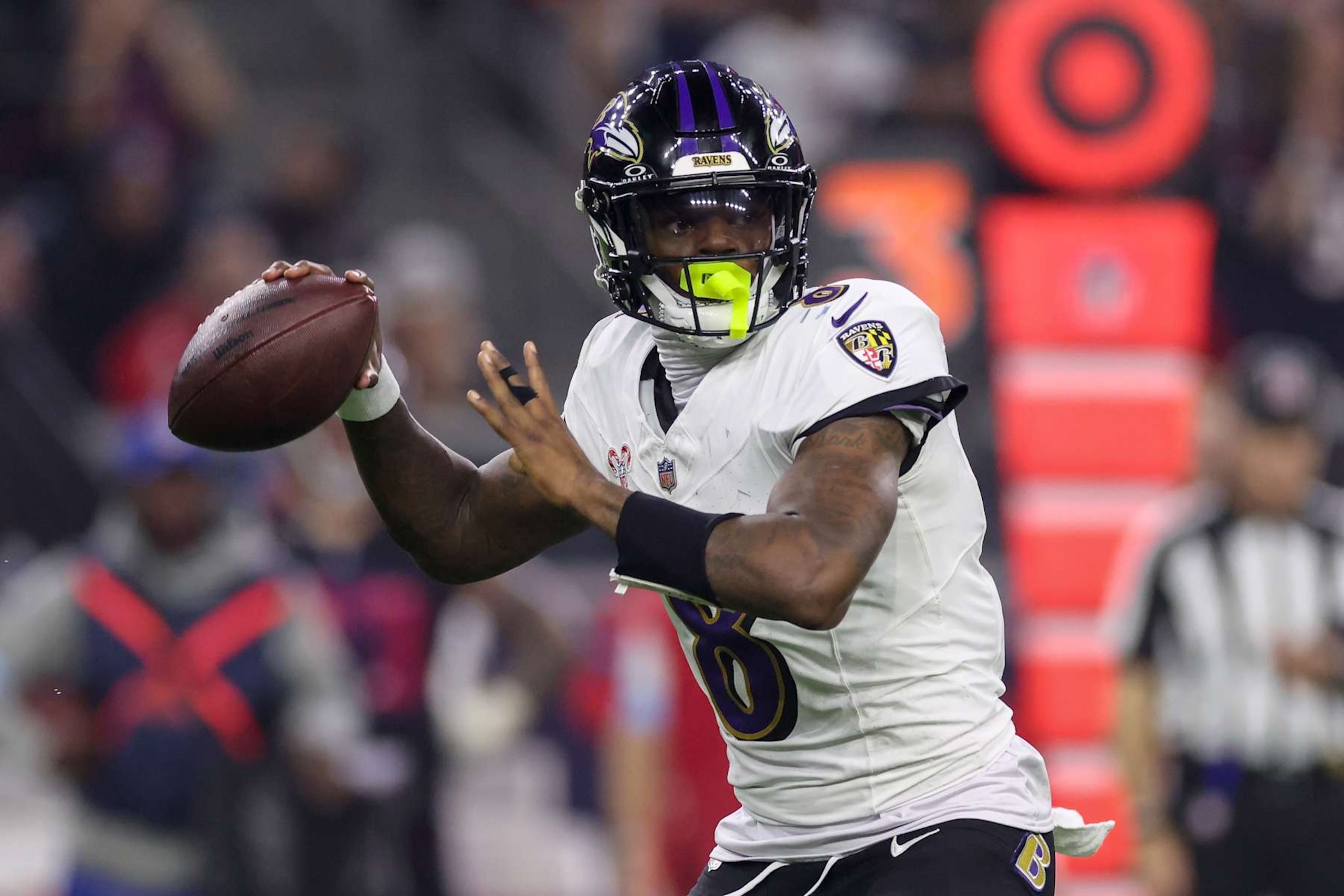 HOUSTON, TEXAS - DECEMBER 25: Lamar Jackson #8 of the Baltimore Ravens throws a pass in the second half against the Houston Texans at NRG Stadium on December 25, 2024 in Houston, Texas. (Photo by Tim Warner/Getty Images)