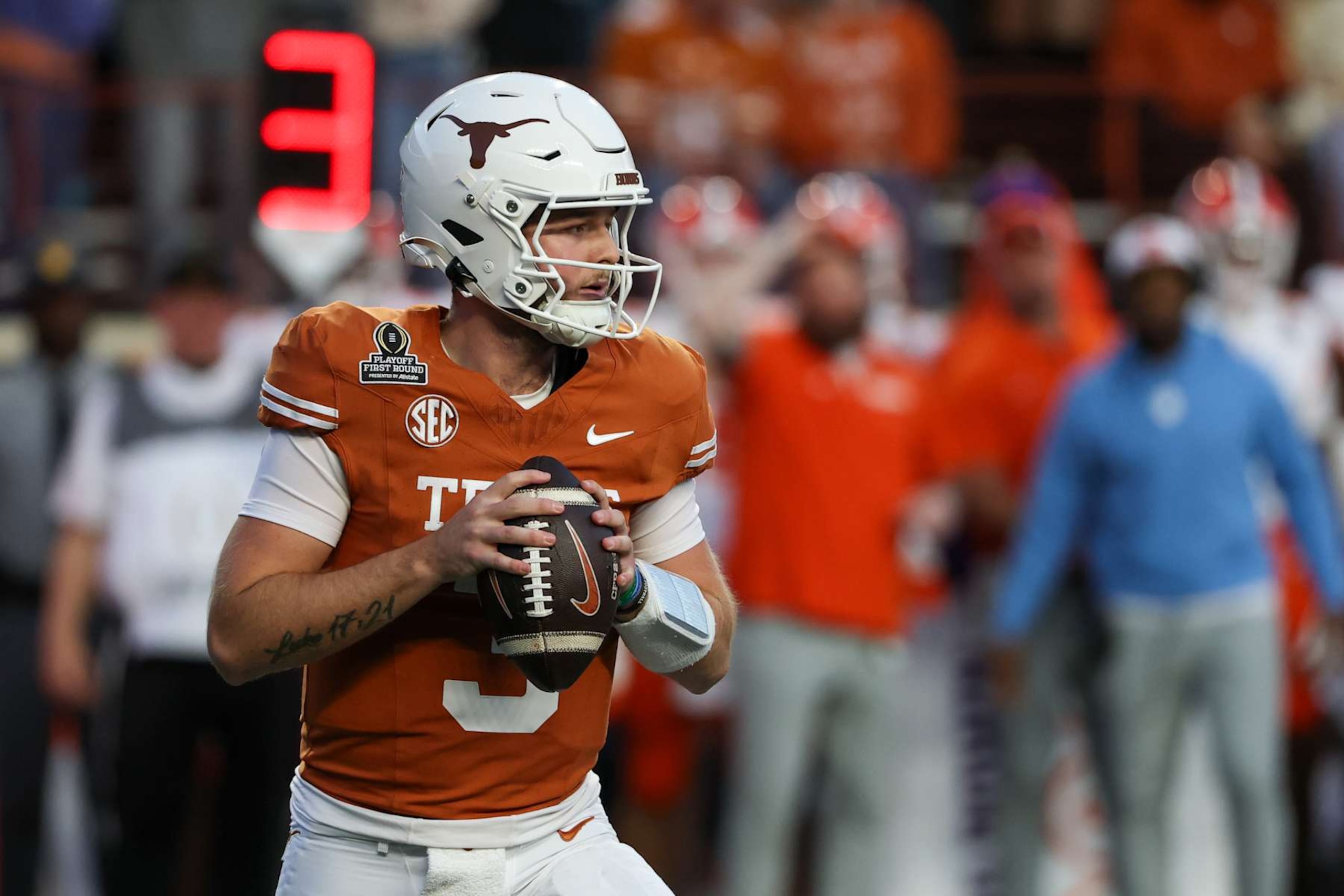 AUSTIN, TX - DECEMBER 21: Texas Longhorns quarterback Quinn Ewers (3) drops back into the pocket during the CFP First Round game between Texas Longhorns and Clemson Tigers on December 21, 2024, at Darrell K Royal - Texas Memorial Stadium in Austin, TX. (Photo by David Buono/Icon Sportswire via Getty Images)