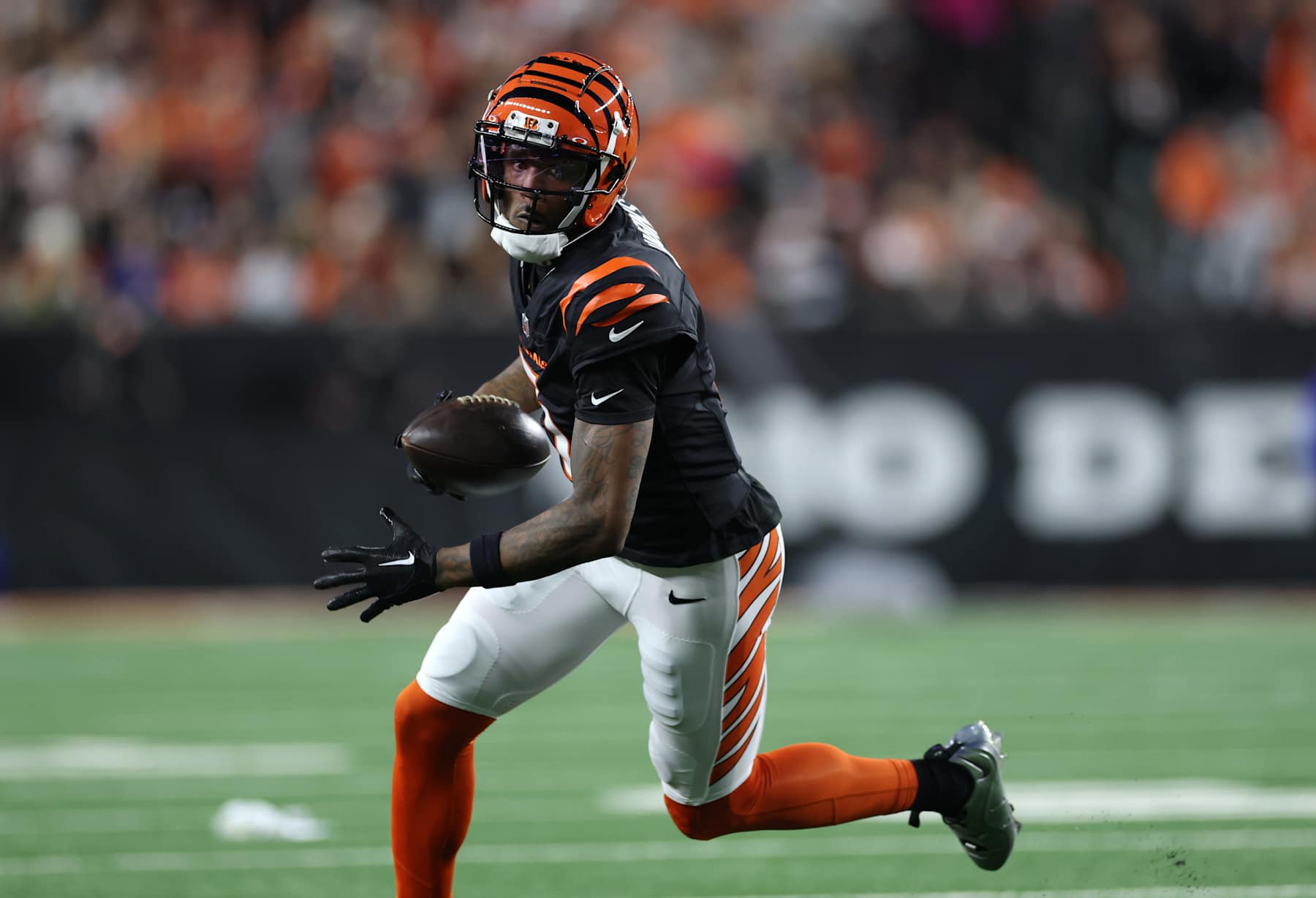 CINCINNATI, OHIO - DECEMBER 28: Tee Higgins #5 of the Cincinnati Bengals runs with the ball during the second quarter against the Denver Broncos at Paycor Stadium on December 28, 2024 in Cincinnati, Ohio. (Photo by Andy Lyons/Getty Images)
