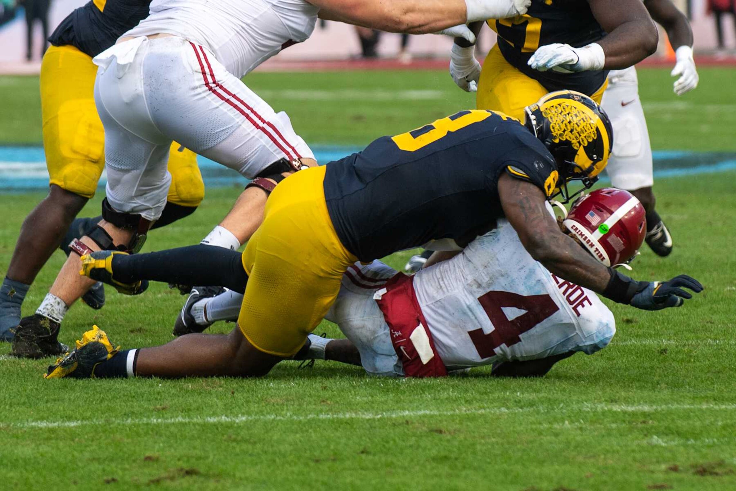 TAMPA, FLORIDA - DECEMBER 31: Derrick Moore #8 of the Michigan Wolverines sacks Jalen Milroe #4 of the Alabama Crimson Tide during the first half of the 2024 ReliaQuest Bowl at Raymond James Stadium on December 31, 2024 in Tampa, Florida. (Photo by Aaron J. Thornton/Getty Images) TAMPA, FLORIDA - DECEMBER 31: Derrick Moore #8 of the Michigan Wolverines sacks Jalen Milroe #4 of the Alabama Crimson Tide during the first half of the 2024 ReliaQuest Bowl at Raymond James Stadium on December 31, 2024 in Tampa, Florida. (Photo by Aaron J. Thornton/Getty Images)