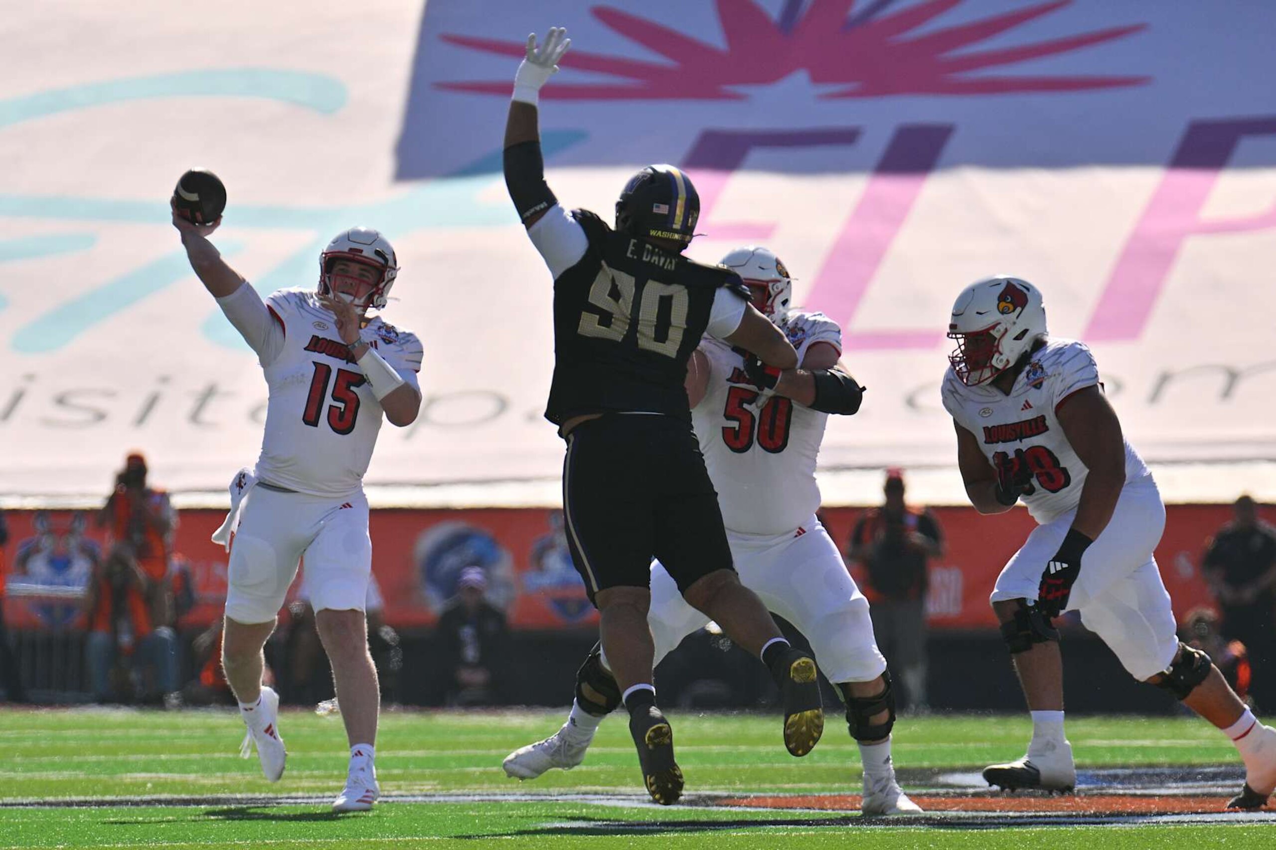 EL PASO, TEXAS - DECEMBER 31: Quarterback Harrison Bailey #15 of the Louisville Cardinals passes as offensive lineman Pete Nygra #50 blocks defensive lineman Elinneus Davis #90 of the Washington Huskies during the first half of the Tony the Tiger Sun Bowl at Sun Bowl Stadium on December 31, 2024 in El Paso, Texas. (Photo by Sam Wasson/Getty Images) EL PASO, TEXAS - DECEMBER 31: Quarterback Harrison Bailey #15 of the Louisville Cardinals passes as offensive lineman Pete Nygra #50 blocks defensive lineman Elinneus Davis #90 of the Washington Huskies during the first half of the Tony the Tiger Sun Bowl at Sun Bowl Stadium on December 31, 2024 in El Paso, Texas. (Photo by Sam Wasson/Getty Images)