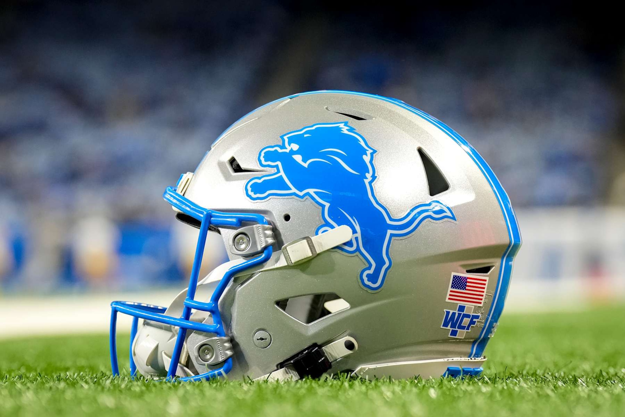 DETROIT, MICHIGAN - DECEMBER 05: A detailed view of the Detroit Lions logo on a helmet on the field before the game against the Green Bay Packers at Ford Field on December 05, 2024 in Detroit, Michigan. (Photo by Nic Antaya/Getty Images)