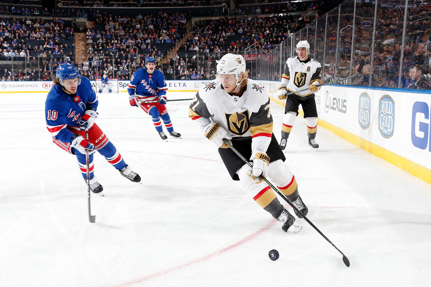 NEW YORK, NY - DECEMBER 02:  William Karlsson #71 of the Vegas Golden Knights skates with the puck against Artemi Panarin #10 of the New York Rangers at Madison Square Garden on December 2, 2019 in New York City. (Photo by Jared Silber/NHLI via Getty Images)