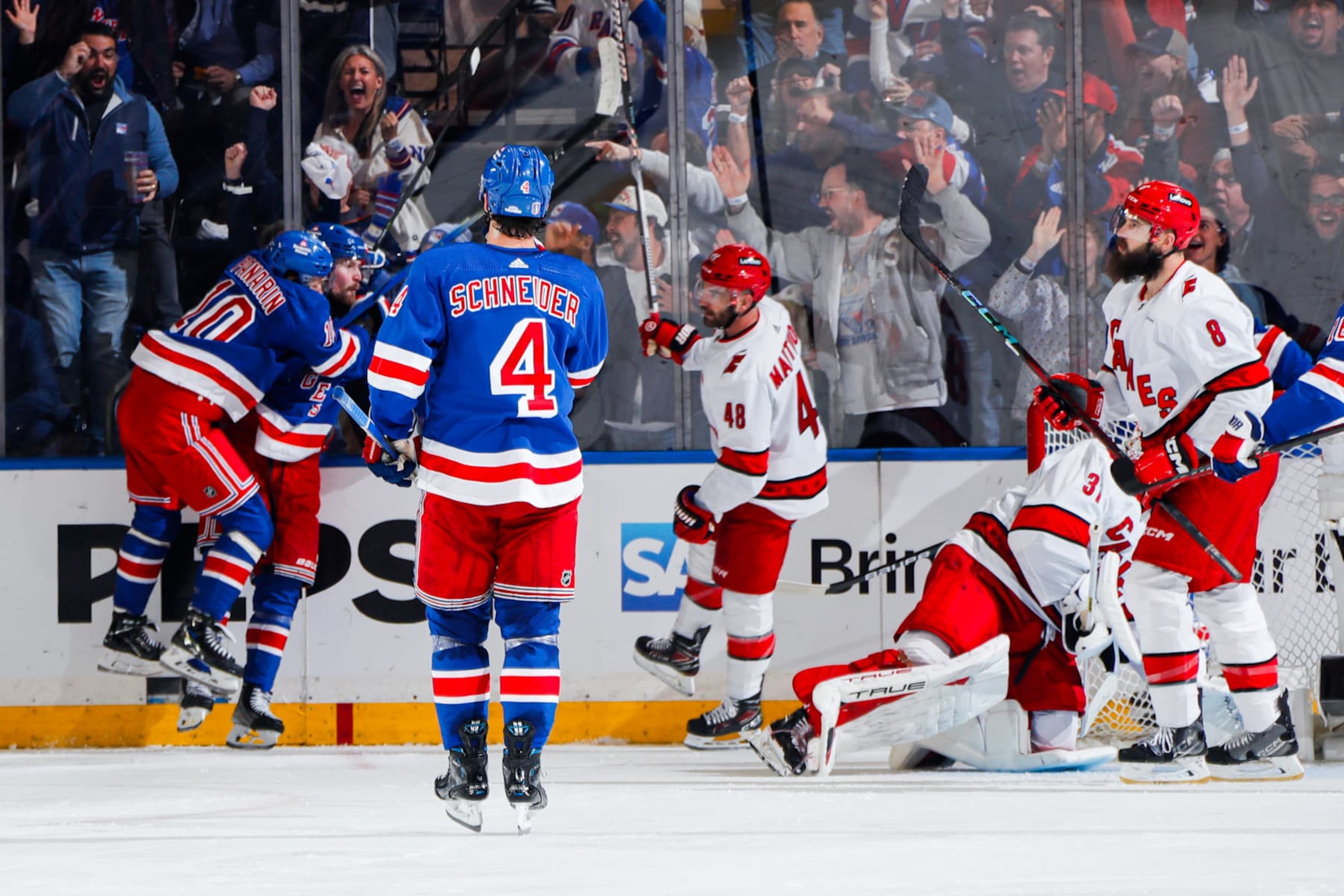 NEW YORK, NEW YORK - MAY 07: Alexis Lafreniere #13 of the New York Rangers celebrates his goal with Artemi Panarin #10 and Braden Schneider #4 during the second period against the Carolina Hurricanes in Game Two of the Second Round of the 2024 Stanley Cup Playoffs at Madison Square Garden on May 7, 2024 in New York City. (Photo by Jared Silber/NHLI via Getty Images) NEW YORK, NEW YORK - MAY 07: Alexis Lafreniere #13 of the New York Rangers celebrates his goal with Artemi Panarin #10 and Braden Schneider #4 during the second period against the Carolina Hurricanes in Game Two of the Second Round of the 2024 Stanley Cup Playoffs at Madison Square Garden on May 7, 2024 in New York City. (Photo by Jared Silber/NHLI via Getty Images)