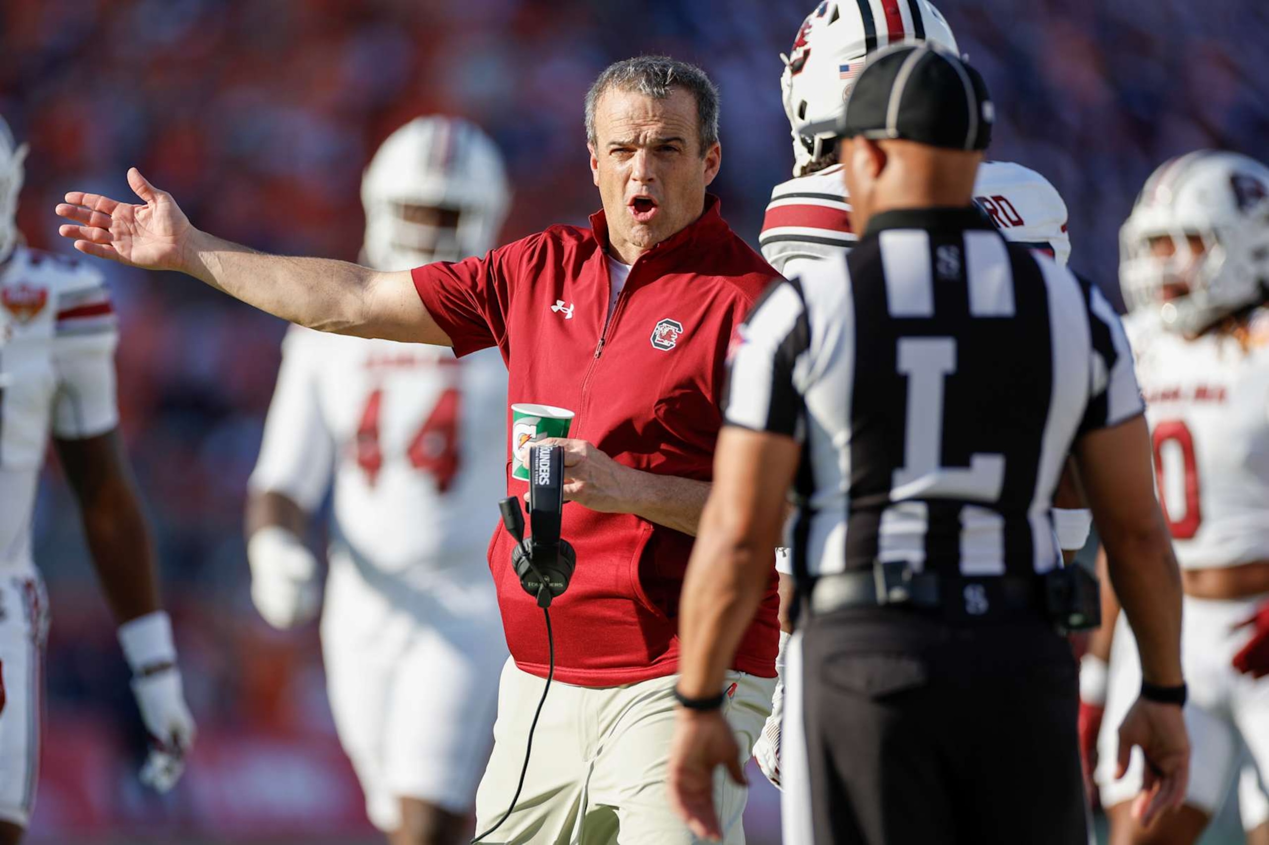ORLANDO, FL - DECEMBER 31: South Carolina Gamecocks head coach Shane Beamer questions a call to an official during the game between the South Carolina Gamecocks and the Illinois Fighting Illini on December 31, 2024 at Camping World Stadium in Orlando, Fl. (Photo by David Rosenblum/Icon Sportswire via Getty Images)