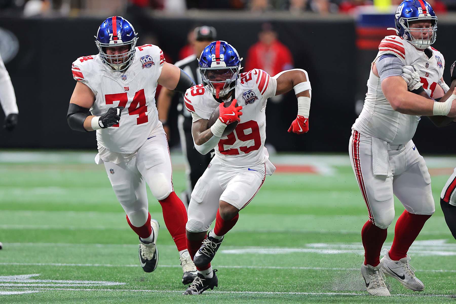 ATLANTA, GA - DECEMBER 22: New York Giants rookie running back Tyrone Tracy, Jr. #29 rushes up the middle during the Sunday afternoon NFL game between the Atlanta Falcons and the New York Giants on Sunday, December 22, 2024 at the Mercedes-Benz Stadium in Atlanta, Georgia.  (Photo by David J. Griffin/Icon Sportswire via Getty Images)