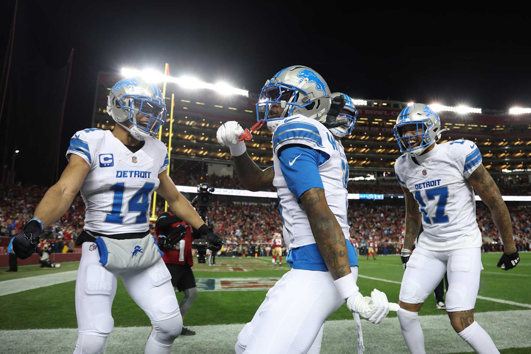 SANTA CLARA, CALIFORNIA - DECEMBER 30: Jameson Williams #9 of the Detroit Lions celebrates after his rushing touchdown against the San Francisco 49ers with Amon-Ra St. Brown #14 and Tim Patrick #17 during the first quarter at Levi's Stadium on December 30, 2024 in Santa Clara, California. (Photo by Ezra Shaw/Getty Images)