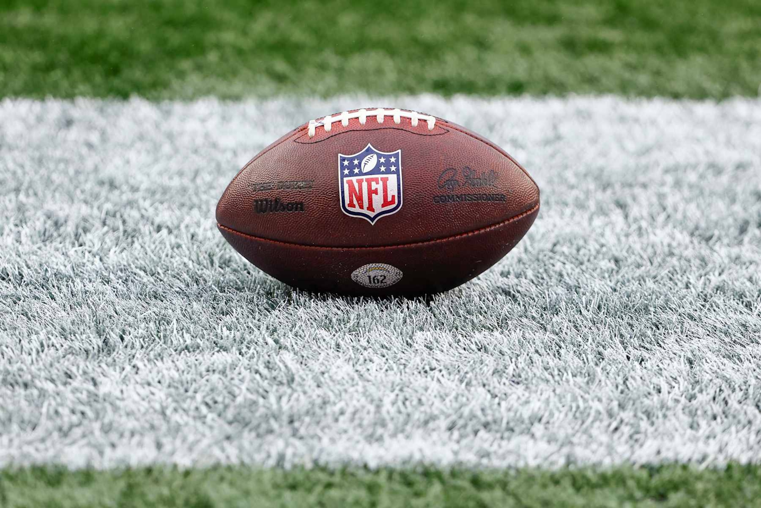FOXBOROUGH, MA - DECEMBER 28: The NFL logo is seen on an official Wilson game ball before the game between the New England Patriots and the Los Angeles Chargers at Gillette Stadium on December 28, 2024 in Foxborough, Massachusetts.(Photo By Winslow Townson/Getty Images)