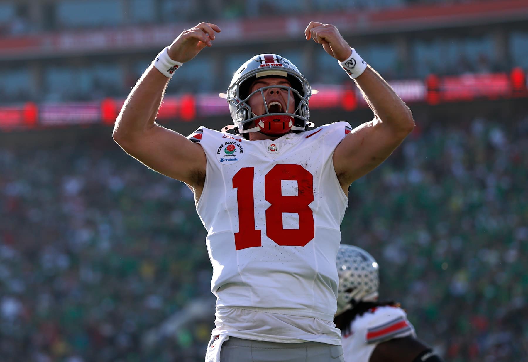 PASADENA, CALIFORNIA - JANUARY 01: Will Howard #18 of the Ohio State Buckeyes celebrates a touchdown during the first quarter against the Oregon Ducks during the Rose Bowl Game Presented by Prudential at Rose Bowl Stadium on January 01, 2025 in Pasadena, California. (Photo by Ronald Martinez/Getty Images)