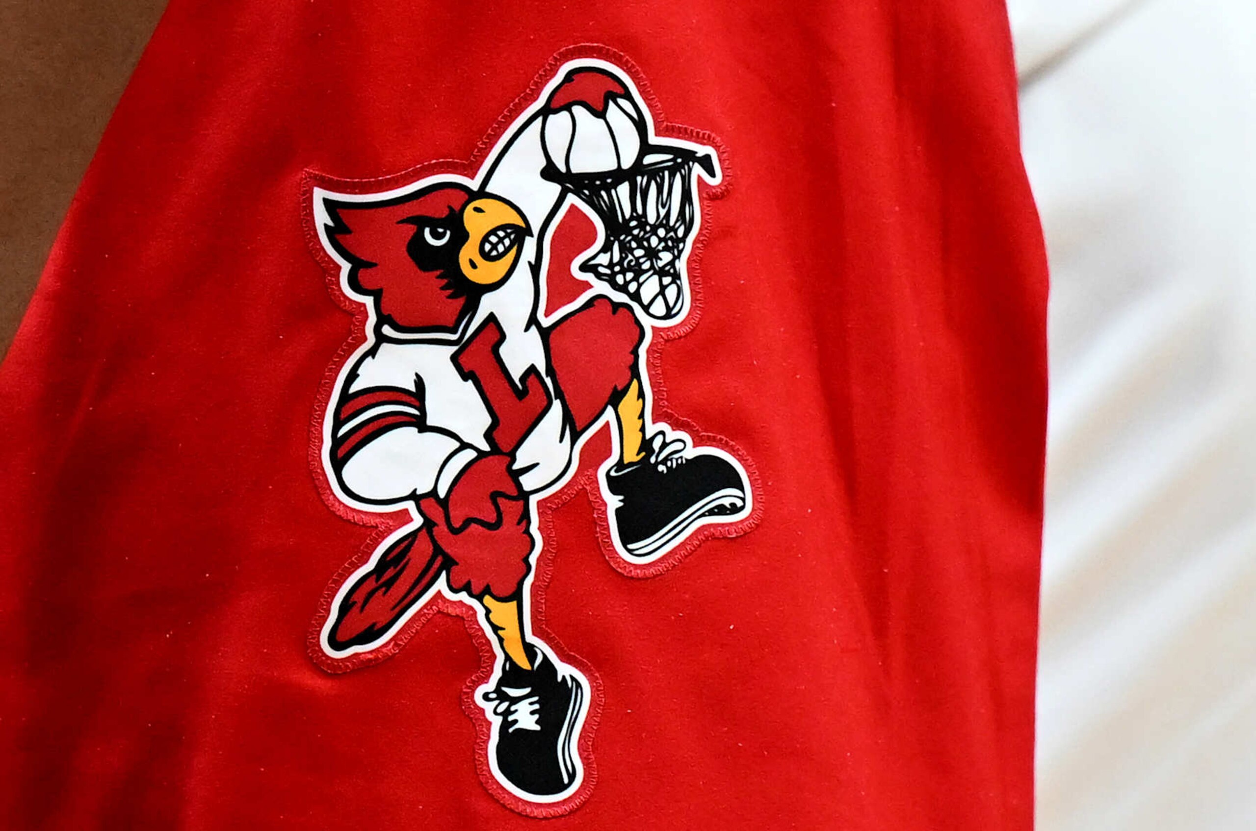 WASHINGTON, DC - MARCH 12: A view of the Louisville Cardinals logo on their uniform during the game against the North Carolina State Wolfpack in the First Round of the ACC Men's Basketball Tournament at Capital One Arena on March 12, 2024 in Washington, DC. (Photo by G Fiume/Getty Images) WASHINGTON, DC - MARCH 12: A view of the Louisville Cardinals logo on their uniform during the game against the North Carolina State Wolfpack in the First Round of the ACC Men's Basketball Tournament at Capital One Arena on March 12, 2024 in Washington, DC. (Photo by G Fiume/Getty Images)