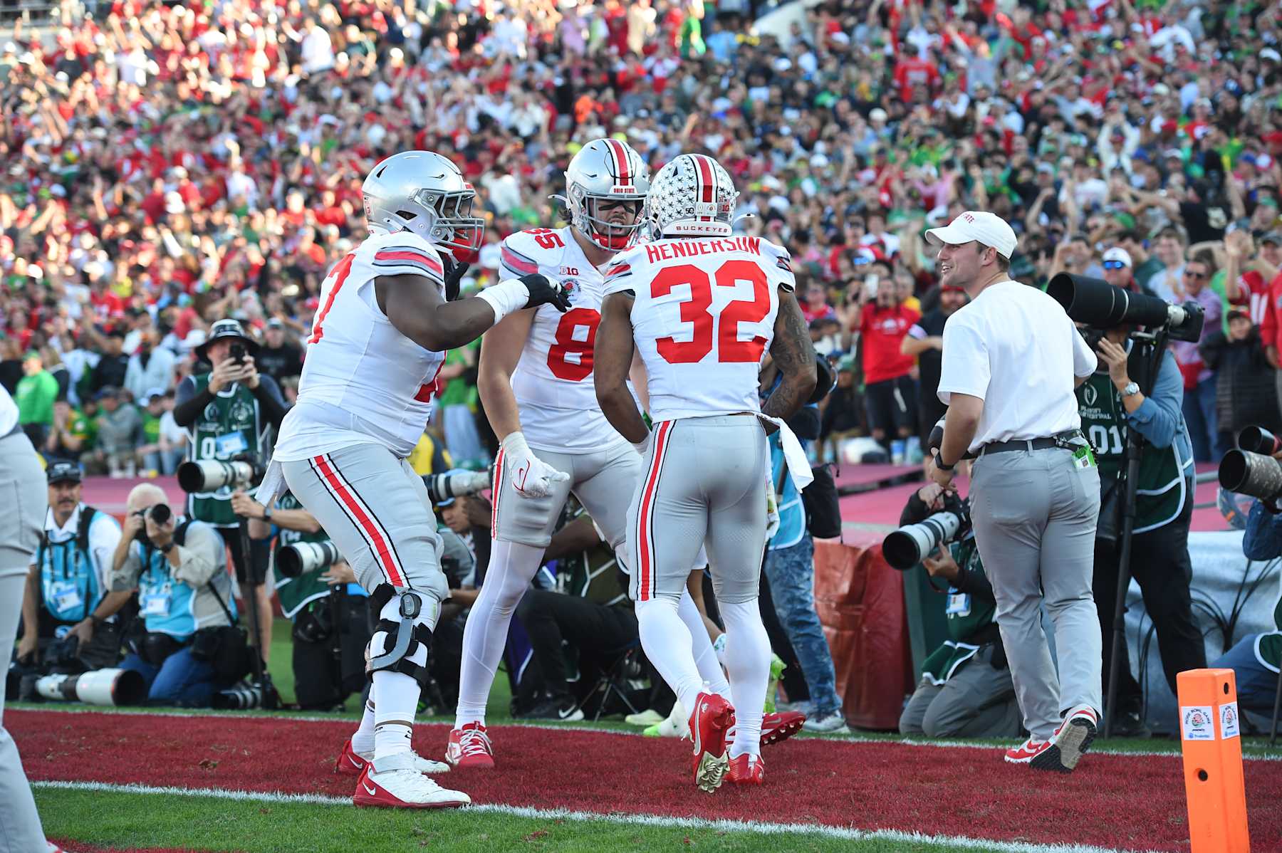 PASADENA, CA - JANUARY 01: Running Back TreVeyon Henderson #32 of the Ohio State Buckeyes celebrates with teammates after a 66 yards touchdown run during the Ohio State Buckeyes versus Oregon Ducks College Football Playoff Quarterfinal at the Rose Bowl Game on January 1, 2025, at the Rose Bowl Stadium in Pasadena, CA. (Photo by Chris Williams/Icon Sportswire via Getty Images)