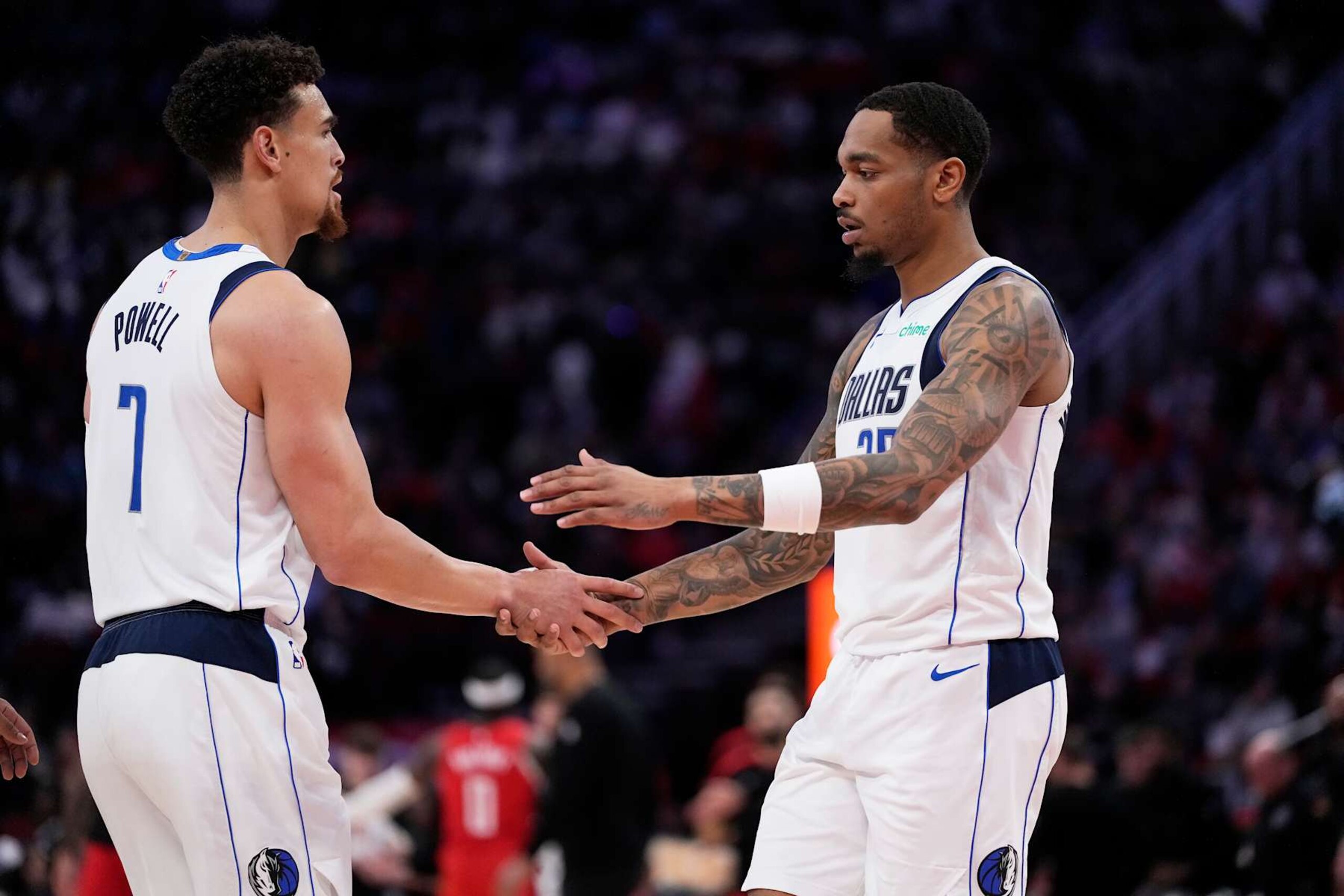 HOUSTON, TX - JANUARY 1: P.J Washington #25 and Dwight Powell #7 of the Dallas Mavericks high five during the game against the Houston Rockets on January 1, 2025 at the Toyota Center in Houston, Texas. NOTE TO USER: User expressly acknowledges and agrees that, by downloading and or using this photograph, User is consenting to the terms and conditions of the Getty Images License Agreement. Mandatory Copyright Notice: Copyright 2025 NBAE (Photo by Kevin M.Cox/NBAE via Getty Images) HOUSTON, TX - JANUARY 1: P.J Washington #25 and Dwight Powell #7 of the Dallas Mavericks high five during the game against the Houston Rockets on January 1, 2025 at the Toyota Center in Houston, Texas. NOTE TO USER: User expressly acknowledges and agrees that, by downloading and or using this photograph, User is consenting to the terms and conditions of the Getty Images License Agreement. Mandatory Copyright Notice: Copyright 2025 NBAE (Photo by Kevin M.Cox/NBAE via Getty Images)
