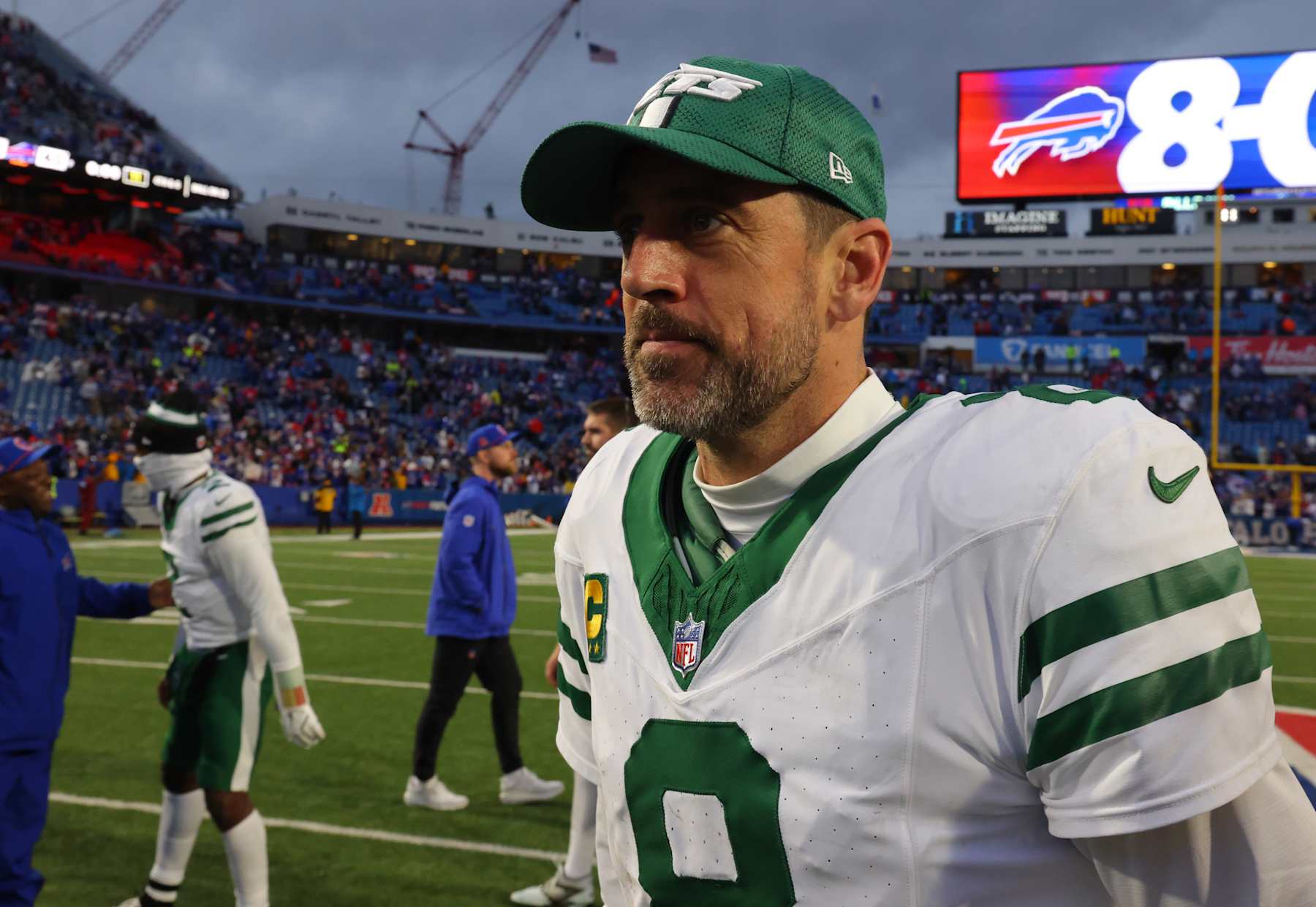 ORCHARD PARK, NEW YORK - DECEMBER 29: Aaron Rodgers #8 of the New York Jets walks off the field after a game against the Buffalo Bills at Highmark Stadium on December 29, 2024 in Orchard Park, New York. (Photo by Timothy T Ludwig/Getty Images)