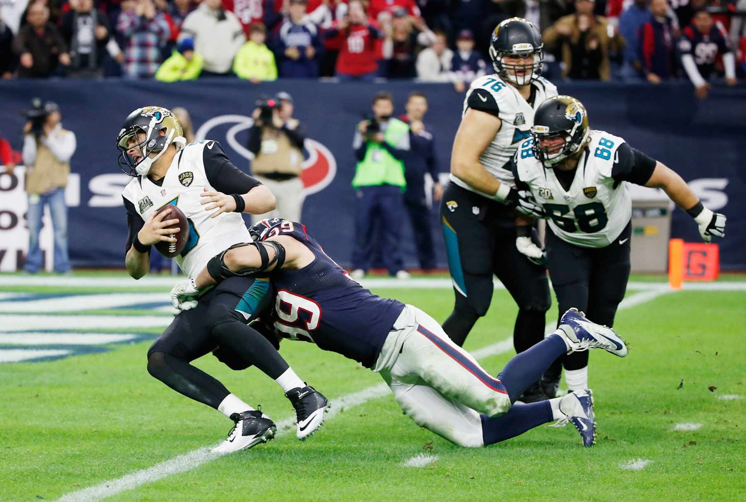 HOUSTON, TX - DECEMBER 28: Blake Bortles #5 of the Jacksonville Jaguars is sacked by J.J. Watt #99 of the Houston Texans in the fourth quarter during their game at NRG Stadium on December 28, 2014 in Houston, Texas. (Photo by Scott Halleran/Getty Images) HOUSTON, TX - DECEMBER 28: Blake Bortles #5 of the Jacksonville Jaguars is sacked by J.J. Watt #99 of the Houston Texans in the fourth quarter during their game at NRG Stadium on December 28, 2014 in Houston, Texas. (Photo by Scott Halleran/Getty Images)