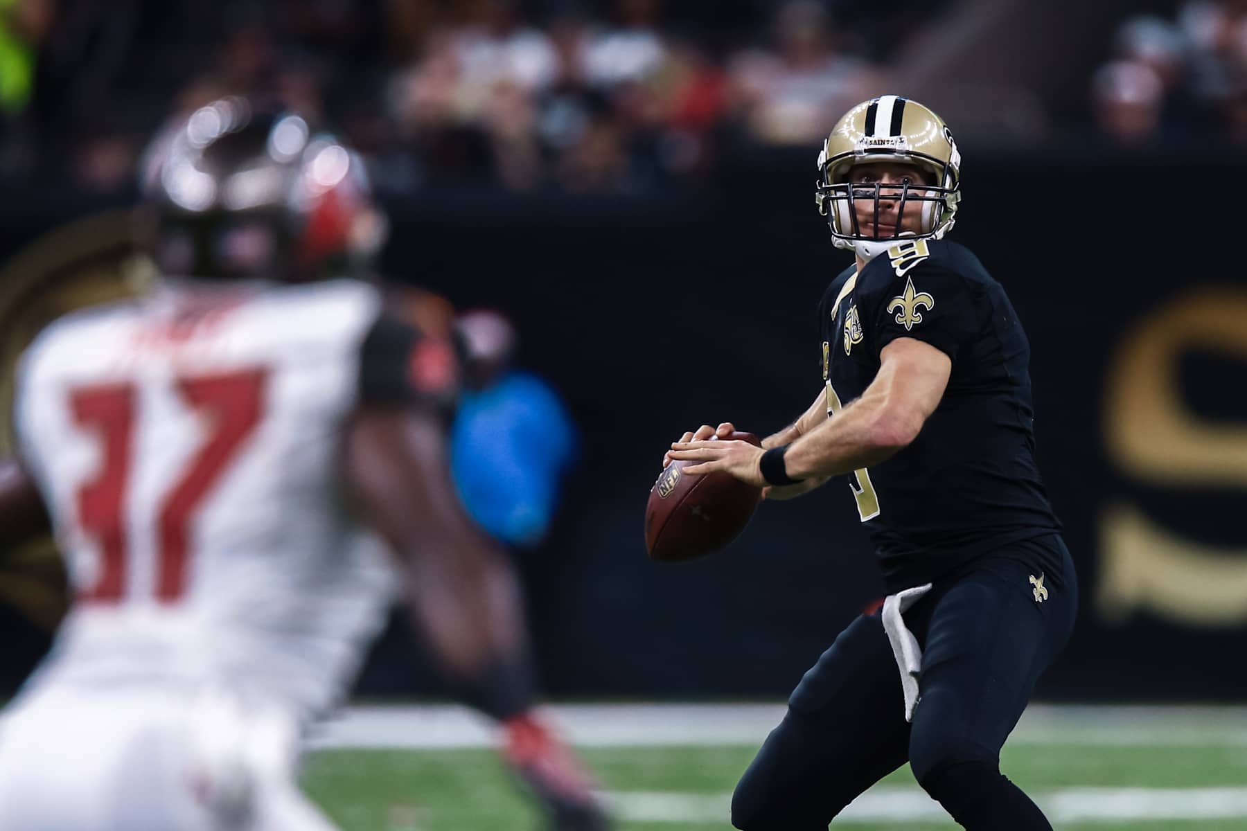 NEW ORLEANS, LA - DECEMBER 24: Tampa Bay Buccaneers strong safety Keith Tandy (37) eyes New Orleans Saints quarterback Drew Brees (9) as he passes downfield during the NFL game between the New Orleans Saints and the Tampa Bay Buccaneers on December 24, 2016 at the Mercedes-Benz Superdome in New Orleans, LA.  (Photo by Stephen Lew/Icon Sportswire via Getty Images)