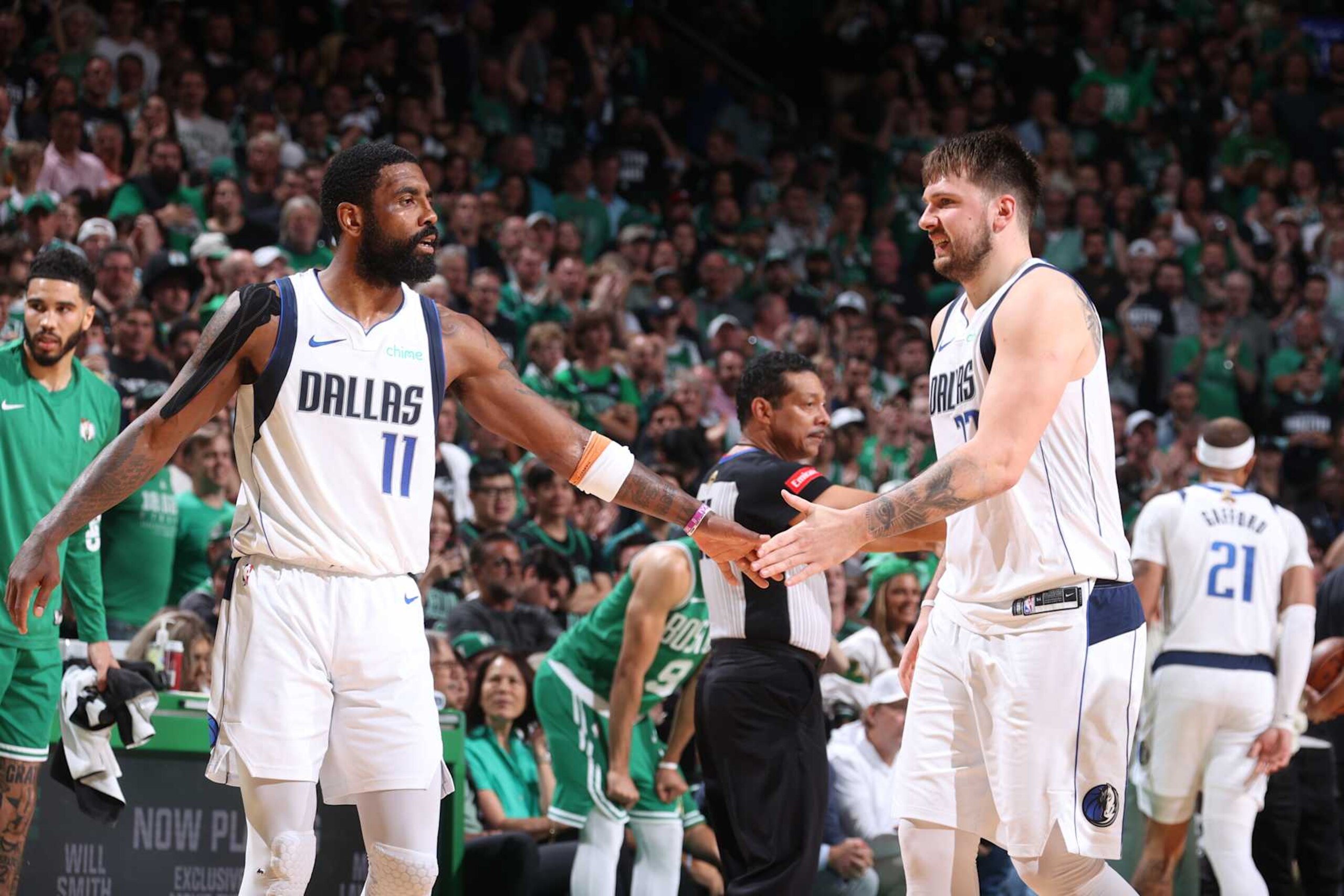 BOSTON, MA - JUNE 17: Kyrie Irving #11 high five Luka Doncic #77 of the Dallas Mavericks during the game against the Boston Celtics during Game 5 of the 2024 NBA Finals on June 17, 2024 at the TD Garden in Boston, Massachusetts. NOTE TO USER: User expressly acknowledges and agrees that, by downloading and or using this photograph, User is consenting to the terms and conditions of the Getty Images License Agreement. Mandatory Copyright Notice: Copyright 2024 NBAE (Photo by Nathaniel S. Butler/NBAE via Getty Images) BOSTON, MA - JUNE 17: Kyrie Irving #11 high five Luka Doncic #77 of the Dallas Mavericks during the game against the Boston Celtics during Game 5 of the 2024 NBA Finals on June 17, 2024 at the TD Garden in Boston, Massachusetts. NOTE TO USER: User expressly acknowledges and agrees that, by downloading and or using this photograph, User is consenting to the terms and conditions of the Getty Images License Agreement. Mandatory Copyright Notice: Copyright 2024 NBAE (Photo by Nathaniel S. Butler/NBAE via Getty Images)