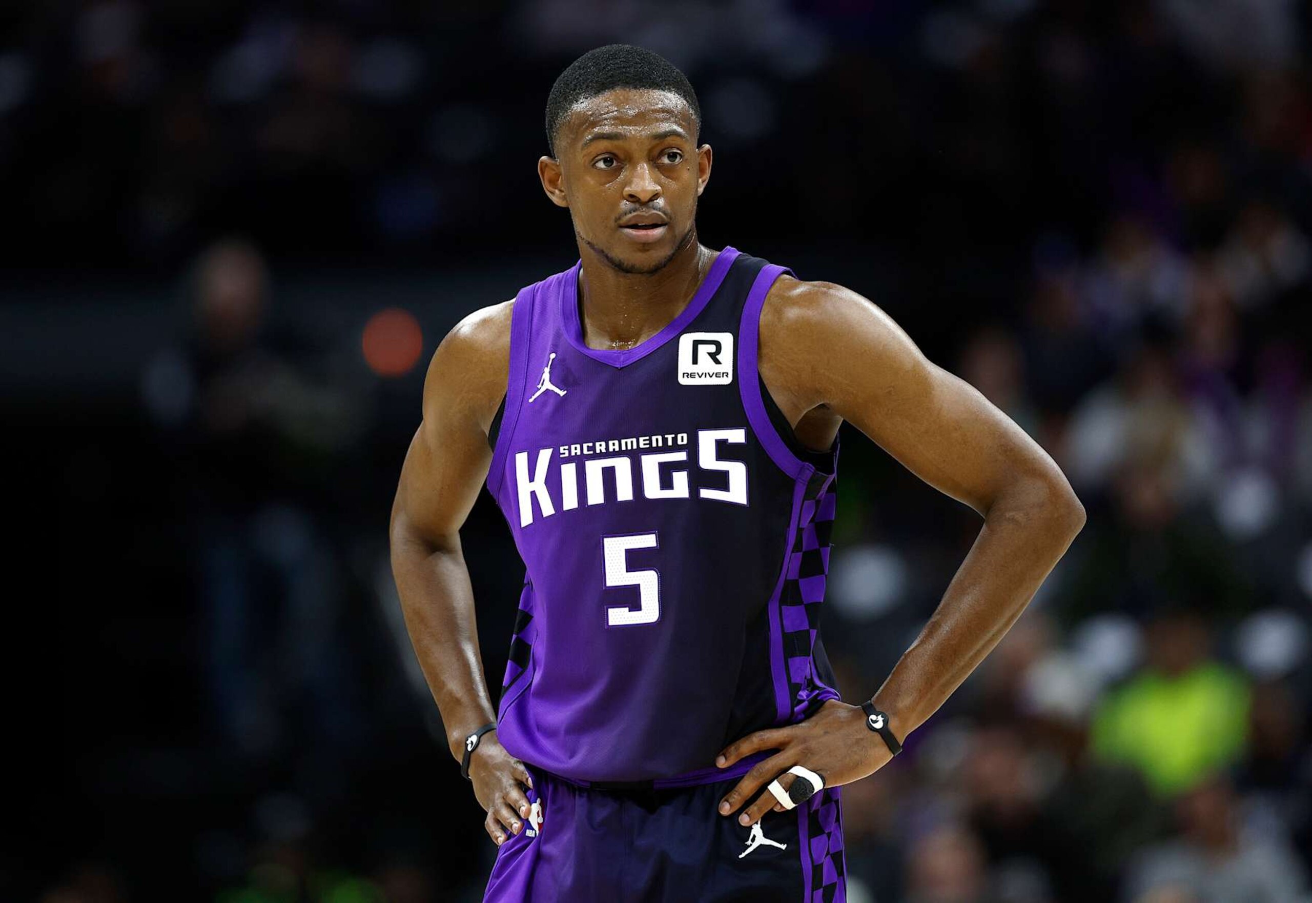 SACRAMENTO, CALIFORNIA - JANUARY 01: De'Aaron Fox #5 of the Sacramento Kings looks on against the Philadelphia 76ers during the first half of an NBA basketball game at Golden 1 Center on January 01, 2025 in Sacramento, California. NOTE TO USER: User expressly acknowledges and agrees that, by downloading and or using this photograph, User is consenting to the terms and conditions of the Getty Images License Agreement. (Photo by Thearon W. Henderson/Getty Images) SACRAMENTO, CALIFORNIA - JANUARY 01: De'Aaron Fox #5 of the Sacramento Kings looks on against the Philadelphia 76ers during the first half of an NBA basketball game at Golden 1 Center on January 01, 2025 in Sacramento, California. NOTE TO USER: User expressly acknowledges and agrees that, by downloading and or using this photograph, User is consenting to the terms and conditions of the Getty Images License Agreement. (Photo by Thearon W. Henderson/Getty Images)