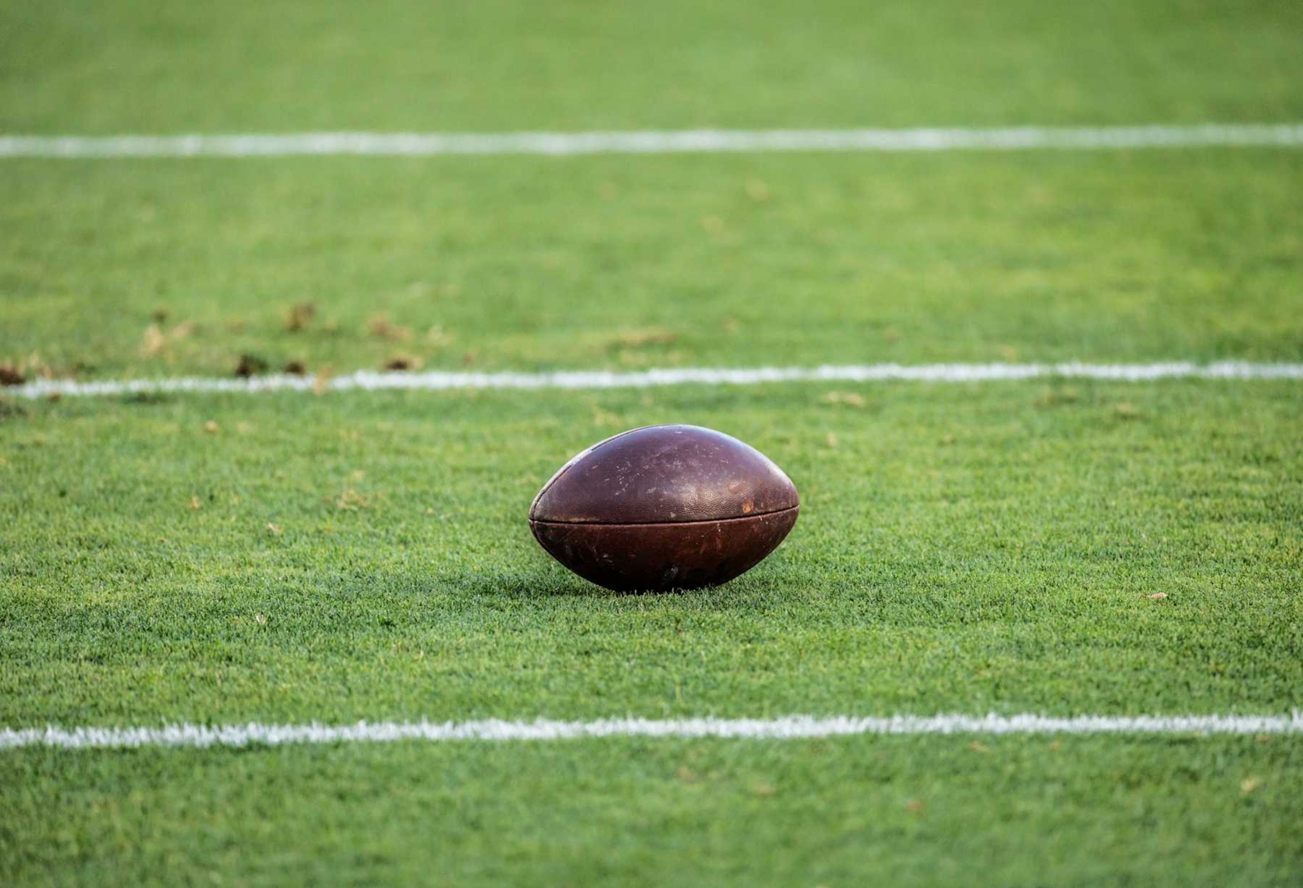 PALO ALTO, CA - AUGUST 30: A detail view of an American football on the field at Stanford Stadium before an NCAA college football game between the TCU Horned Frogs and the Stanford Cardinal on August 30, 2024 at Stanford Stadium in Palo Alto, California. (Photo by David Madison/Getty Images) PALO ALTO, CA - AUGUST 30: A detail view of an American football on the field at Stanford Stadium before an NCAA college football game between the TCU Horned Frogs and the Stanford Cardinal on August 30, 2024 at Stanford Stadium in Palo Alto, California. (Photo by David Madison/Getty Images)