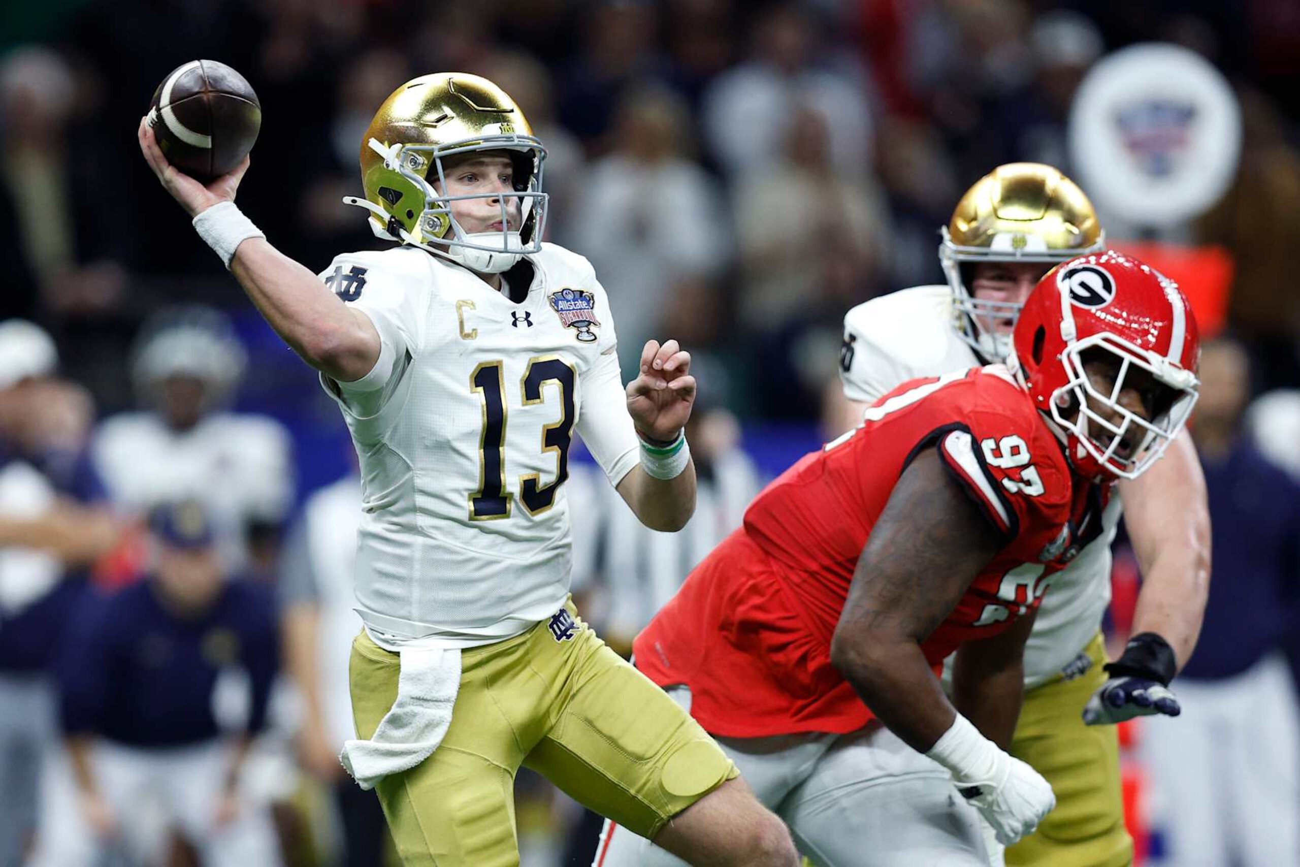 NEW ORLEANS, LOUISIANA - JANUARY 02: Riley Leonard #13 of the Notre Dame Fighting Irish throws a pass during the first quarter against the Georgia Bulldogs during the 91st Allstate Sugar Bowl at Caesars Superdome on January 02, 2025 in New Orleans, Louisiana. (Photo by Sean Gardner/Getty Images) NEW ORLEANS, LOUISIANA - JANUARY 02: Riley Leonard #13 of the Notre Dame Fighting Irish throws a pass during the first quarter against the Georgia Bulldogs during the 91st Allstate Sugar Bowl at Caesars Superdome on January 02, 2025 in New Orleans, Louisiana. (Photo by Sean Gardner/Getty Images)