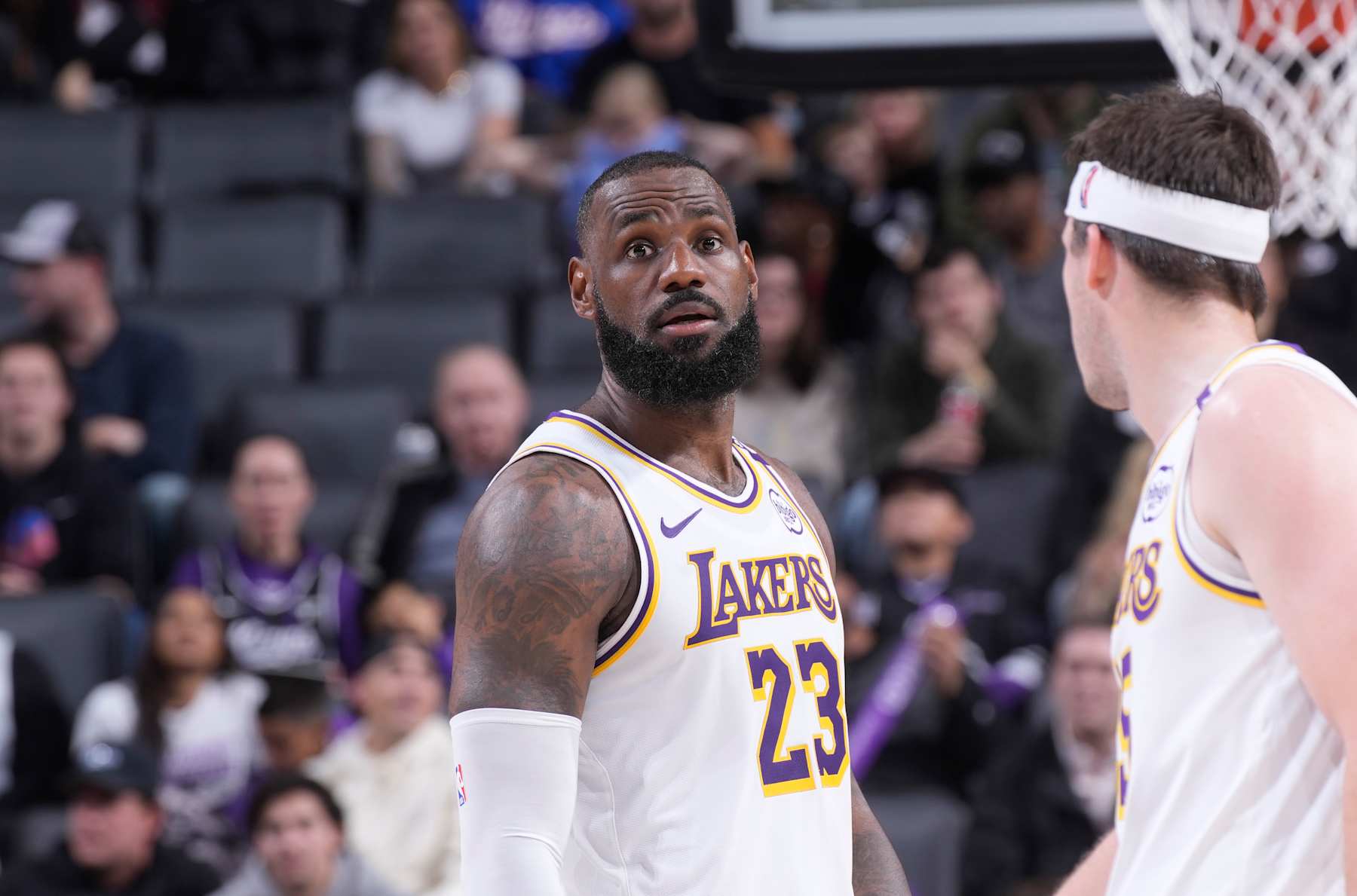 SACRAMENTO, CA - DECEMBER 21: LeBron James #23 and Austin Reaves #15 of the Los Angeles Lakers talk during the game against the Sacramento Kings on December 21, 2024 at Golden 1 Center in Sacramento, California. NOTE TO USER: User expressly acknowledges and agrees that, by downloading and or using this photograph, User is consenting to the terms and conditions of the Getty Images Agreement. Mandatory Copyright Notice: Copyright 2024 NBAE (Photo by Rocky Widner/NBAE via Getty Images)