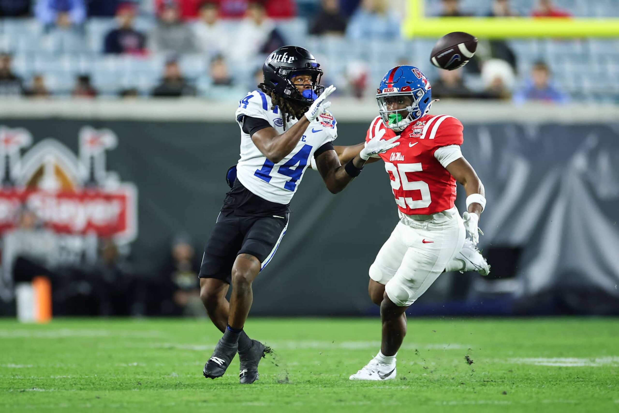 JACKSONVILLE, FLORIDA - JANUARY 02: Que'Sean Brown #14 of the Duke Blue Devils catches a pass against Trey Washington #25 of the Mississippi Rebels during the first half of a game at EverBank Stadium on January 02, 2025 in Jacksonville, Florida. (Photo by James Gilbert/Getty Images) JACKSONVILLE, FLORIDA - JANUARY 02: Que'Sean Brown #14 of the Duke Blue Devils catches a pass against Trey Washington #25 of the Mississippi Rebels during the first half of a game at EverBank Stadium on January 02, 2025 in Jacksonville, Florida. (Photo by James Gilbert/Getty Images)