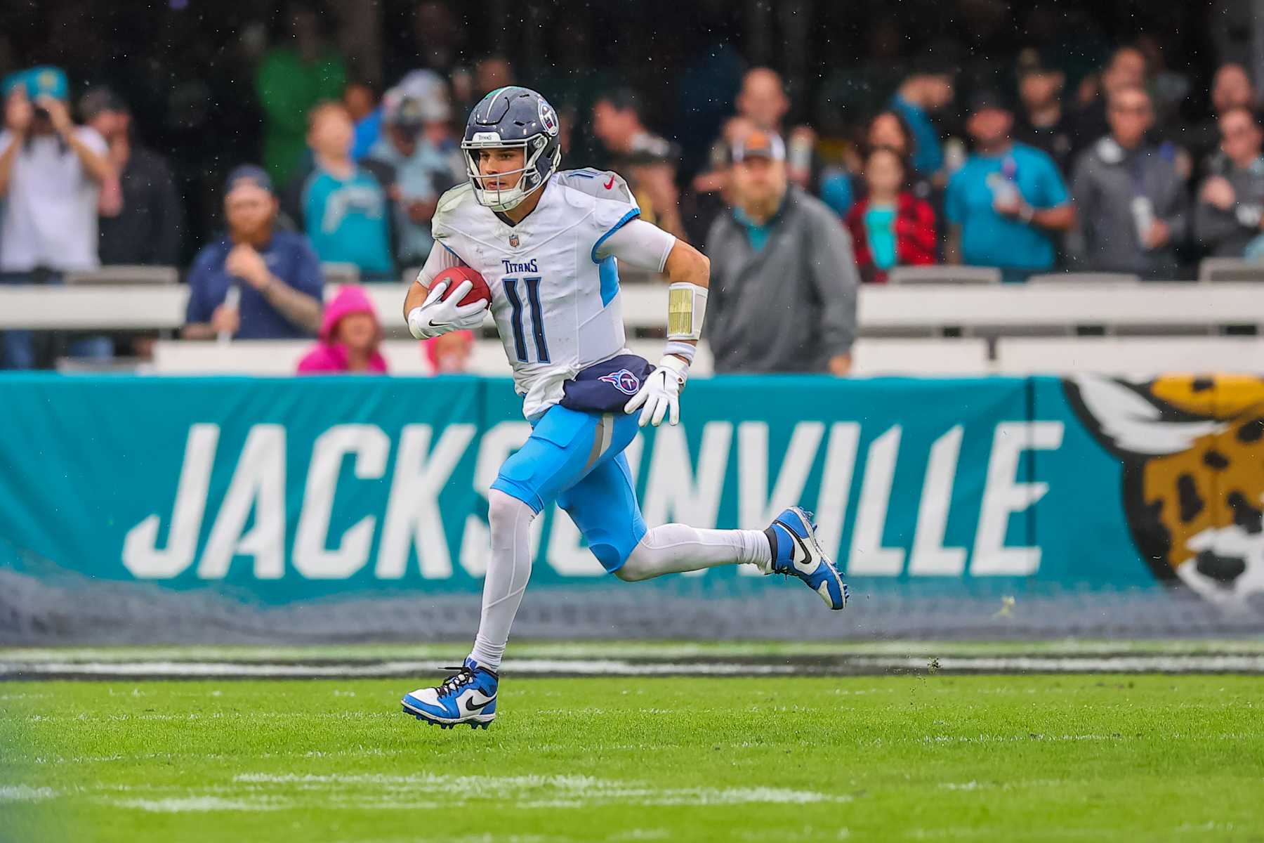 JACKSONVILLE, FLORIDA - DECEMBER 29: Mason Rudolph #11 of the Tennessee Titans runs against the Jacksonville Jaguars at EverBank Field on December 29, 2024 in Jacksonville, Florida. (Photo by Mike Carlson/Getty Images)