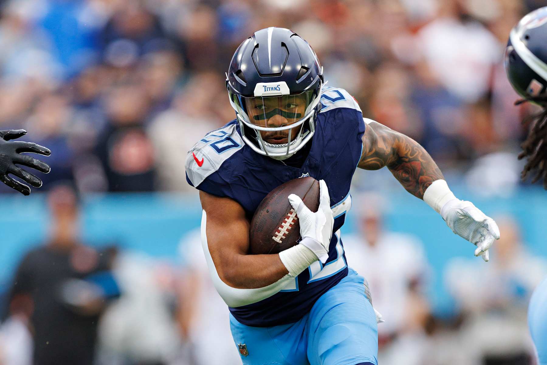 NASHVILLE, TENNESSEE - DECEMBER 15: Tony Pollard #20 of the Tennessee Titans runs the ball during a game against the Cincinnati Bengals at Nissan Stadium on December 15, 2024 in Nashville, Tennessee. The Bengals defeated the Titans 37-27.  (Photo by Wesley Hitt/Getty Images)