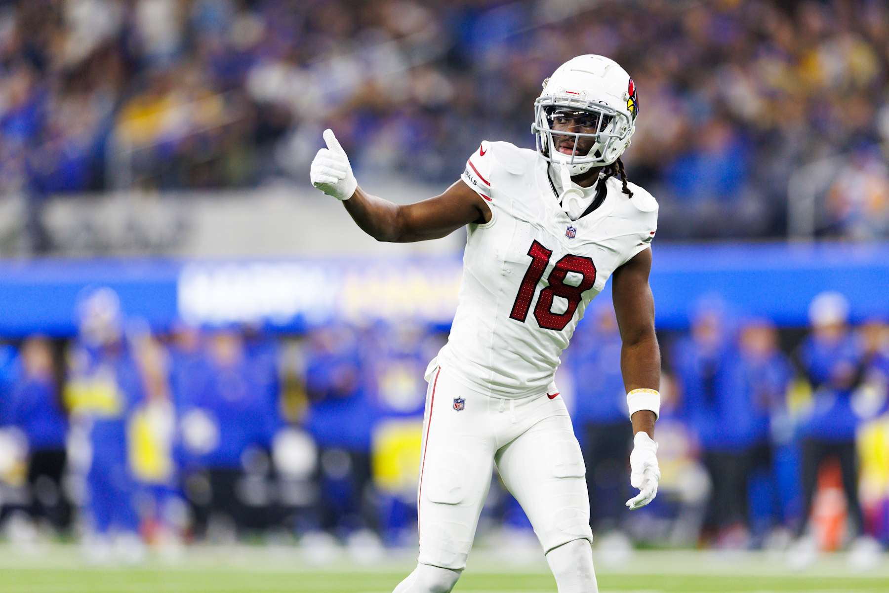 INGLEWOOD, CALIFORNIA - DECEMBER 28: Marvin Harrison Jr. #18 of the Arizona Cardinals signals during the second half against the Los Angeles Rams at SoFi Stadium on December 28, 2024 in Inglewood, California. (Photo by Ric Tapia/Getty Images)
