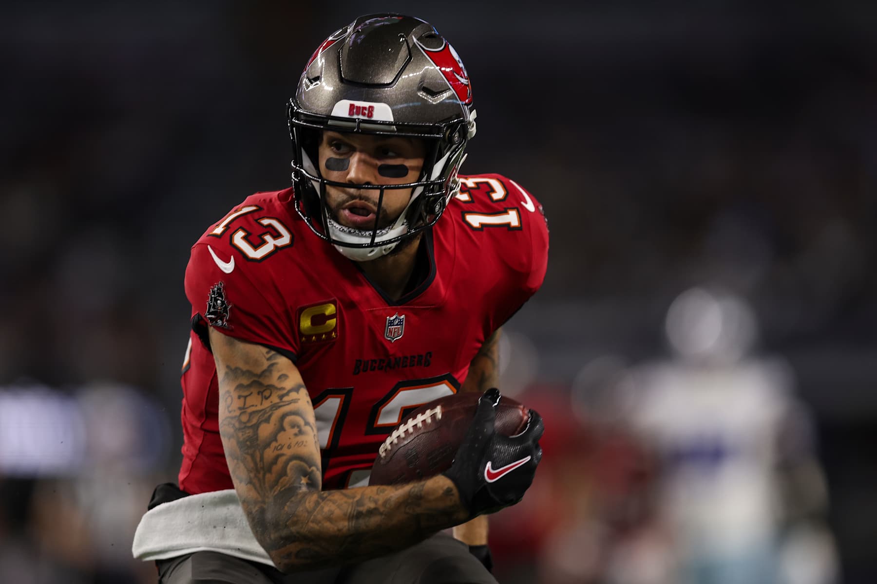 ARLINGTON, TEXAS - DECEMBER 22:  Mike Evans #13 of the Tampa Bay Buccaneers runs the ball during an NFL football game against the Dallas Cowboys at AT&T Stadium on December 22, 2024 in Arlington, Texas. (Photo by Perry Knotts/Getty Images)