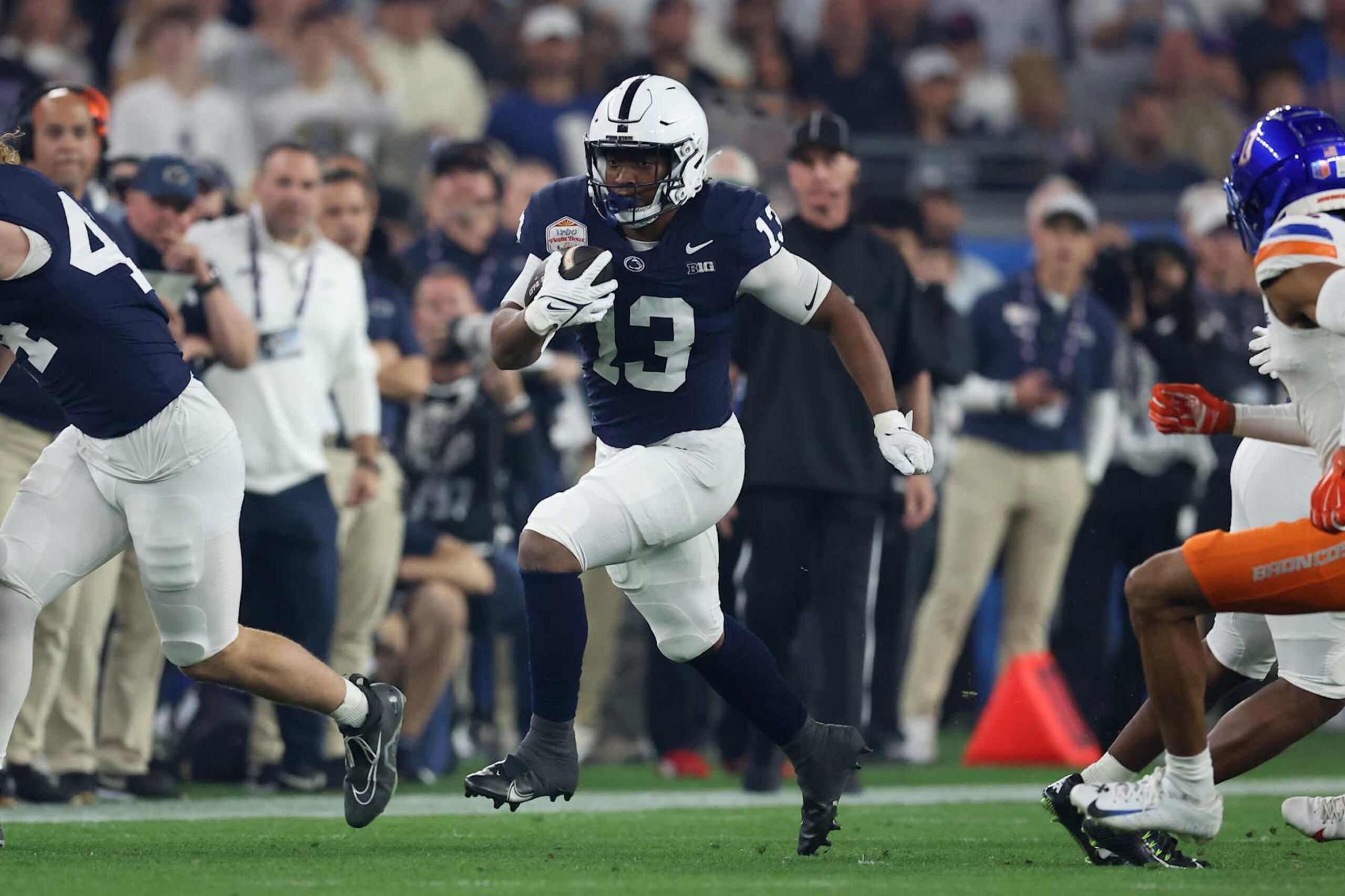 GLENDALE, ARIZONA - DECEMBER 31: Kaytron Allen #13 of the Penn State Nittany Lions runs the ball during the first quarter against the Boise State Broncos in the 2024 Vrbo Fiesta Bowl at State Farm Stadium on December 31, 2024 in Glendale, Arizona. (Photo by Chris Coduto/Getty Images) GLENDALE, ARIZONA - DECEMBER 31: Kaytron Allen #13 of the Penn State Nittany Lions runs the ball during the first quarter against the Boise State Broncos in the 2024 Vrbo Fiesta Bowl at State Farm Stadium on December 31, 2024 in Glendale, Arizona. (Photo by Chris Coduto/Getty Images)