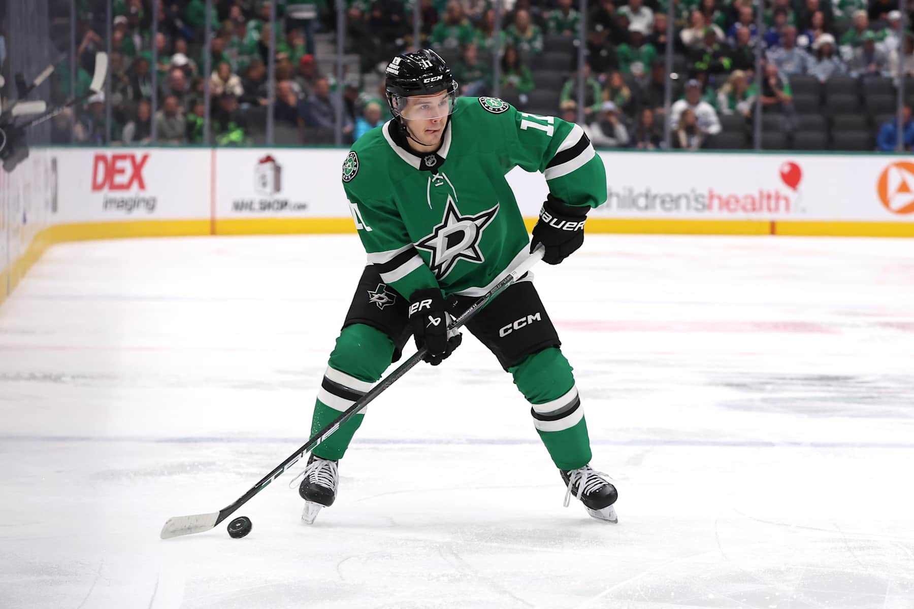 DALLAS, TEXAS - DECEMBER 18: Logan Stankoven #11 of the Dallas Stars skates with the puck during the first period against the Toronto Maple Leafs at American Airlines Center on December 18, 2024 in Dallas, Texas. (Photo by Sam Hodde/Getty Images)