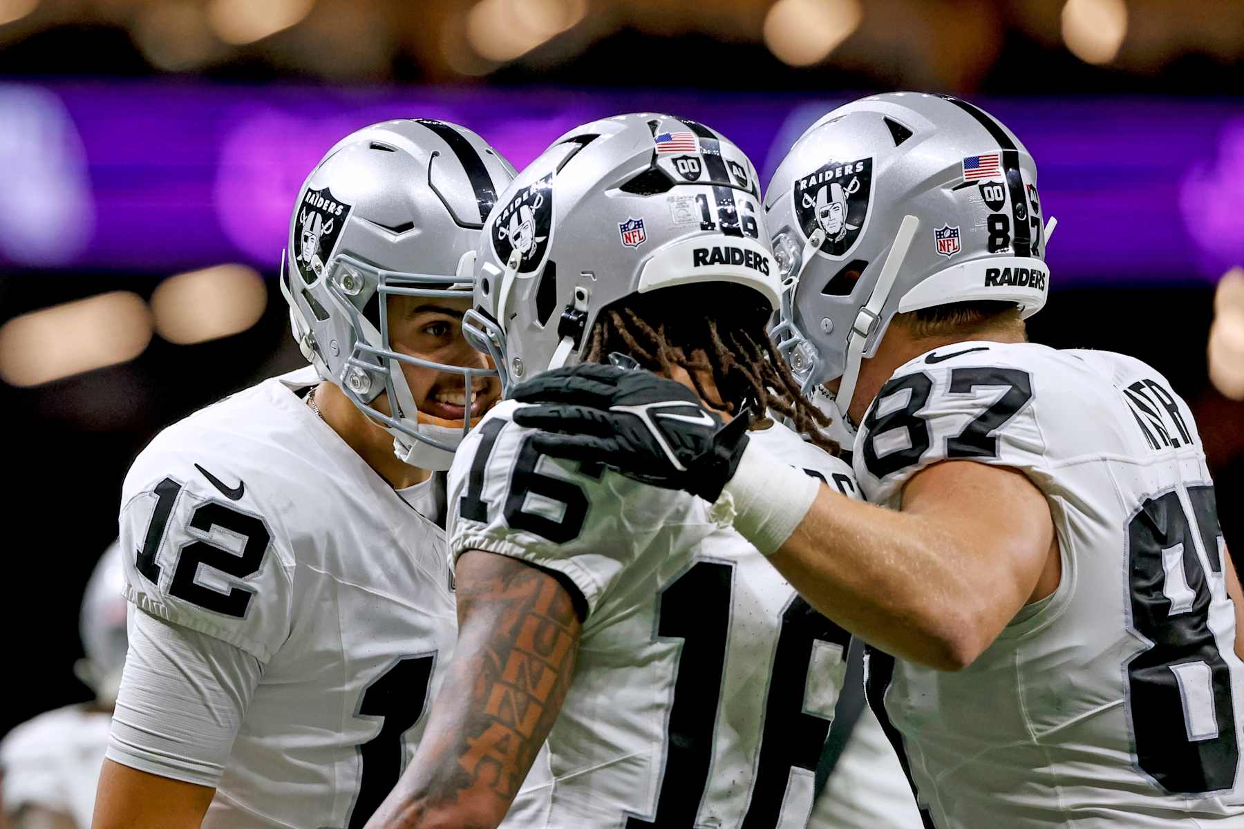 NEW  ORLEANS, LOUISIANA - DECEMBER 29: Aidan O'Connell #12 of the Las Vegas Raiders celebrates with Jakobi Meyers #16 after a touchdown during the first half of a game against the New Orleans Saints at the Caesars Superdome on December 29, 2024 in New Orleans, Louisiana.  (Photo by Derick E. Hingle/Getty Images)