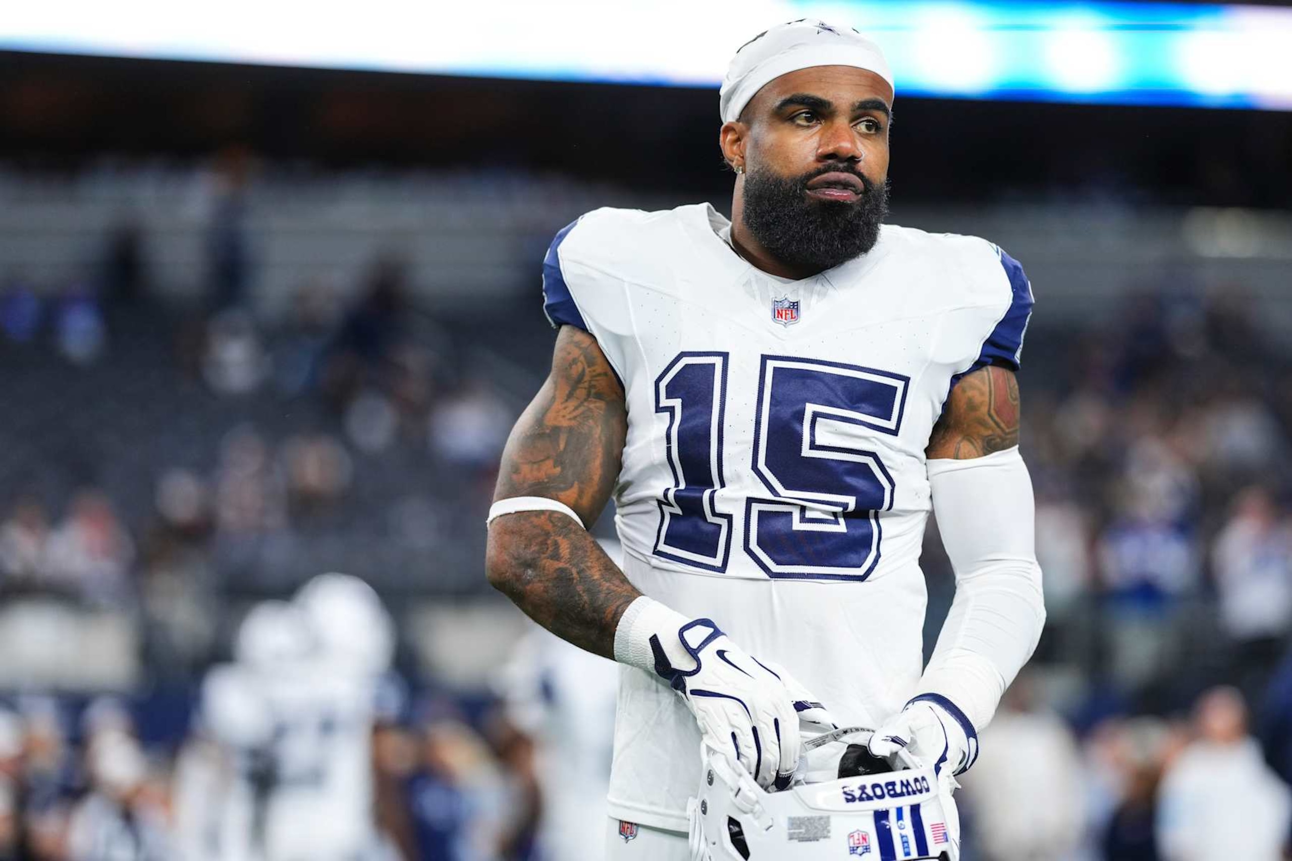 ARLINGTON, TX - DECEMBER 09: Ezekiel Elliott #15 of the Dallas Cowboys warms up prior to an NFL football game against the Cincinnati Bengals at AT&T Stadium on December 9, 2024 in Arlington, Texas. (Photo by Cooper Neill/Getty Images) ARLINGTON, TX - DECEMBER 09: Ezekiel Elliott #15 of the Dallas Cowboys warms up prior to an NFL football game against the Cincinnati Bengals at AT&T Stadium on December 9, 2024 in Arlington, Texas. (Photo by Cooper Neill/Getty Images)