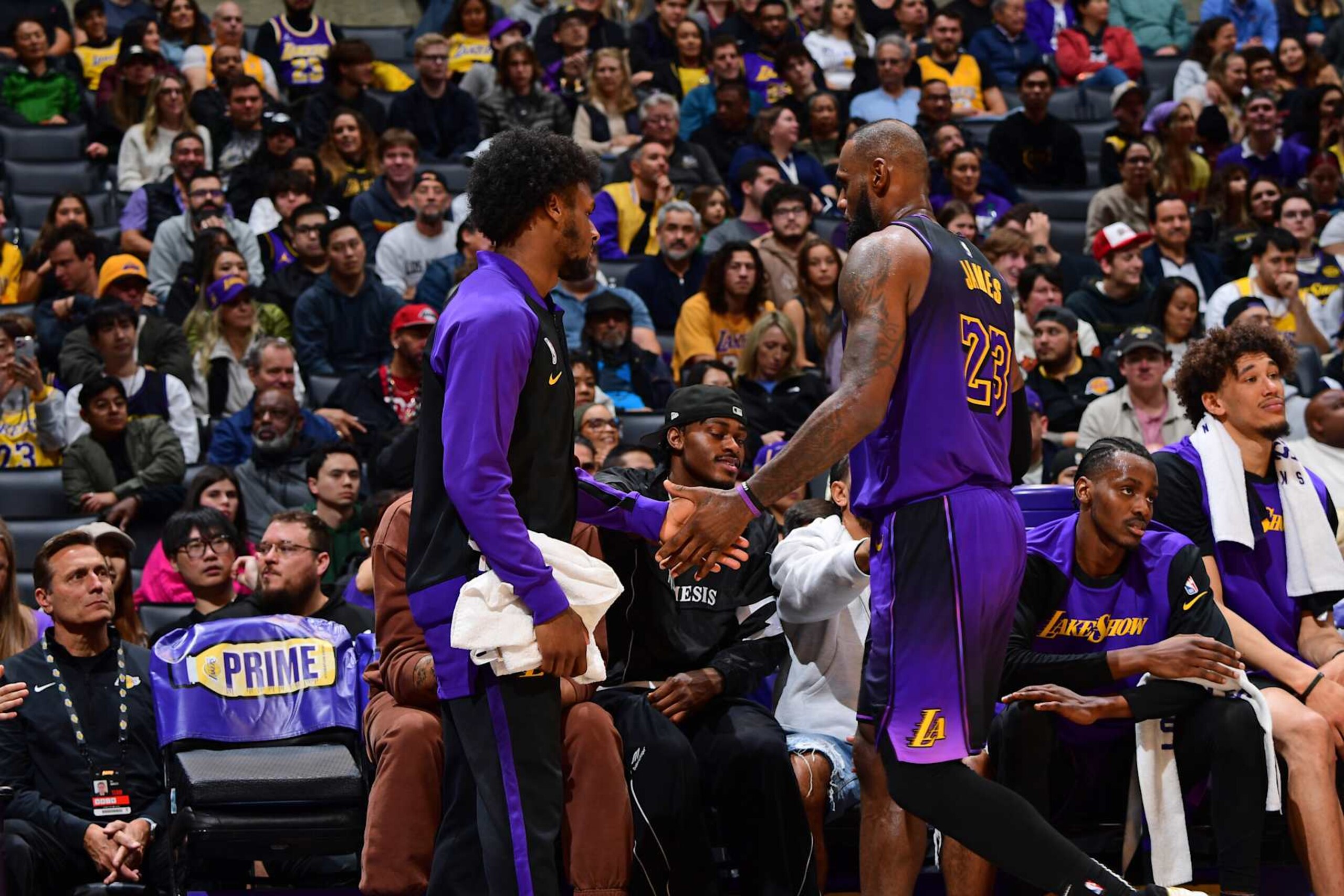 LOS ANGELES, CA - JANUARY 2: Bronny James #9 and LeBron James #23 of the Los Angeles Lakers high five during the game against the Portland Trail Blazers on January 2, 2025 at Crypto.Com Arena in Los Angeles, California. NOTE TO USER: User expressly acknowledges and agrees that, by downloading and/or using this Photograph, user is consenting to the terms and conditions of the Getty Images License Agreement. Mandatory Copyright Notice: Copyright 2025 NBAE (Photo by Adam Pantozzi/NBAE via Getty Images) LOS ANGELES, CA - JANUARY 2: Bronny James #9 and LeBron James #23 of the Los Angeles Lakers high five during the game against the Portland Trail Blazers on January 2, 2025 at Crypto.Com Arena in Los Angeles, California. NOTE TO USER: User expressly acknowledges and agrees that, by downloading and/or using this Photograph, user is consenting to the terms and conditions of the Getty Images License Agreement. Mandatory Copyright Notice: Copyright 2025 NBAE (Photo by Adam Pantozzi/NBAE via Getty Images)
