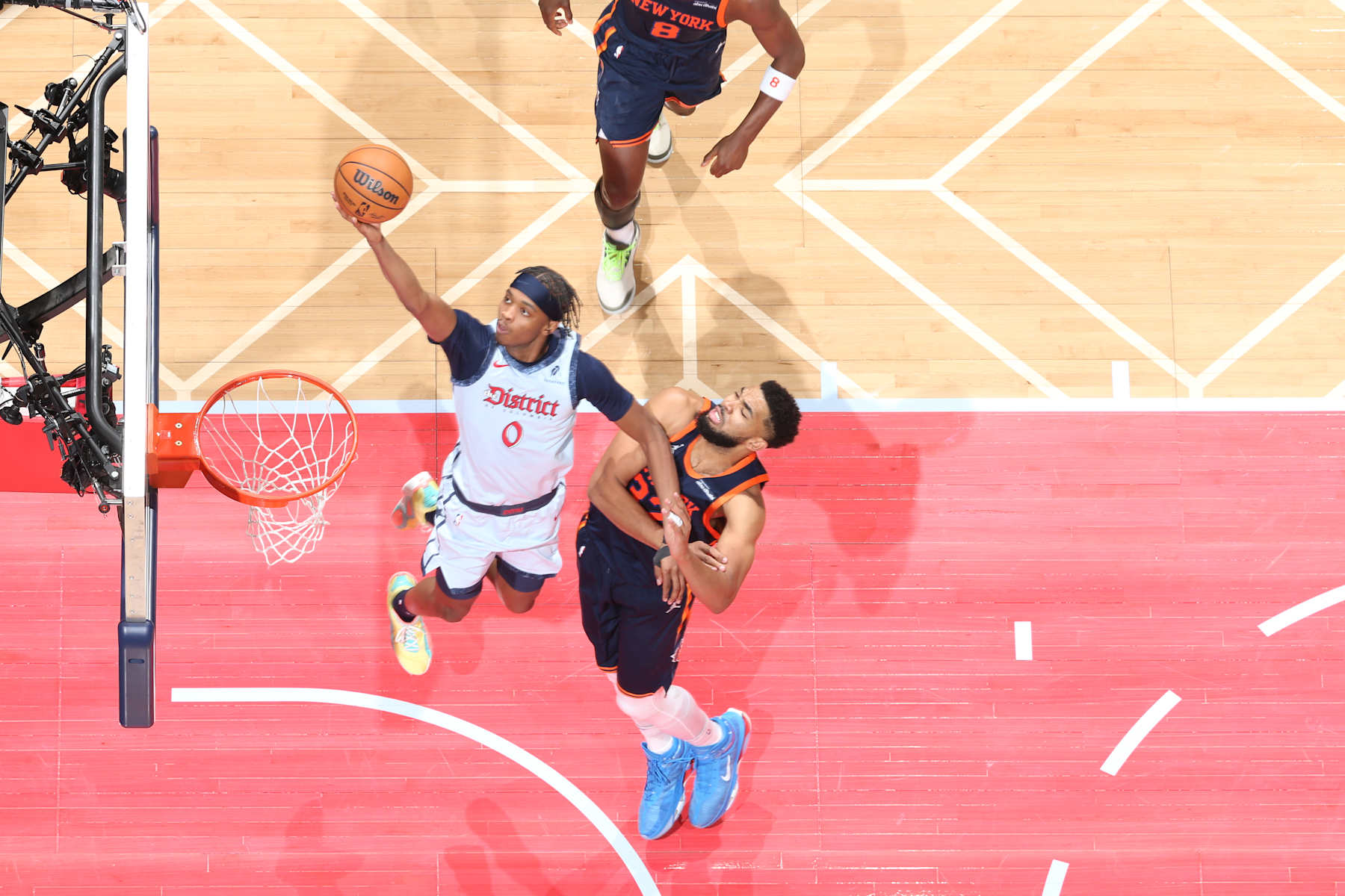 WASHINGTON, DC -  DECEMBER 30: Bilal Coulibaly #0 of the Washington Wizards drives to the basket during the game against the New York Knicks on December 30, 2024 at Capital One Arena in Washington, DC. NOTE TO USER: User expressly acknowledges and agrees that, by downloading and or using this Photograph, user is consenting to the terms and conditions of the Getty Images License Agreement. Mandatory Copyright Notice: Copyright 2024 NBAE (Photo by Stephen Gosling/NBAE via Getty Images)