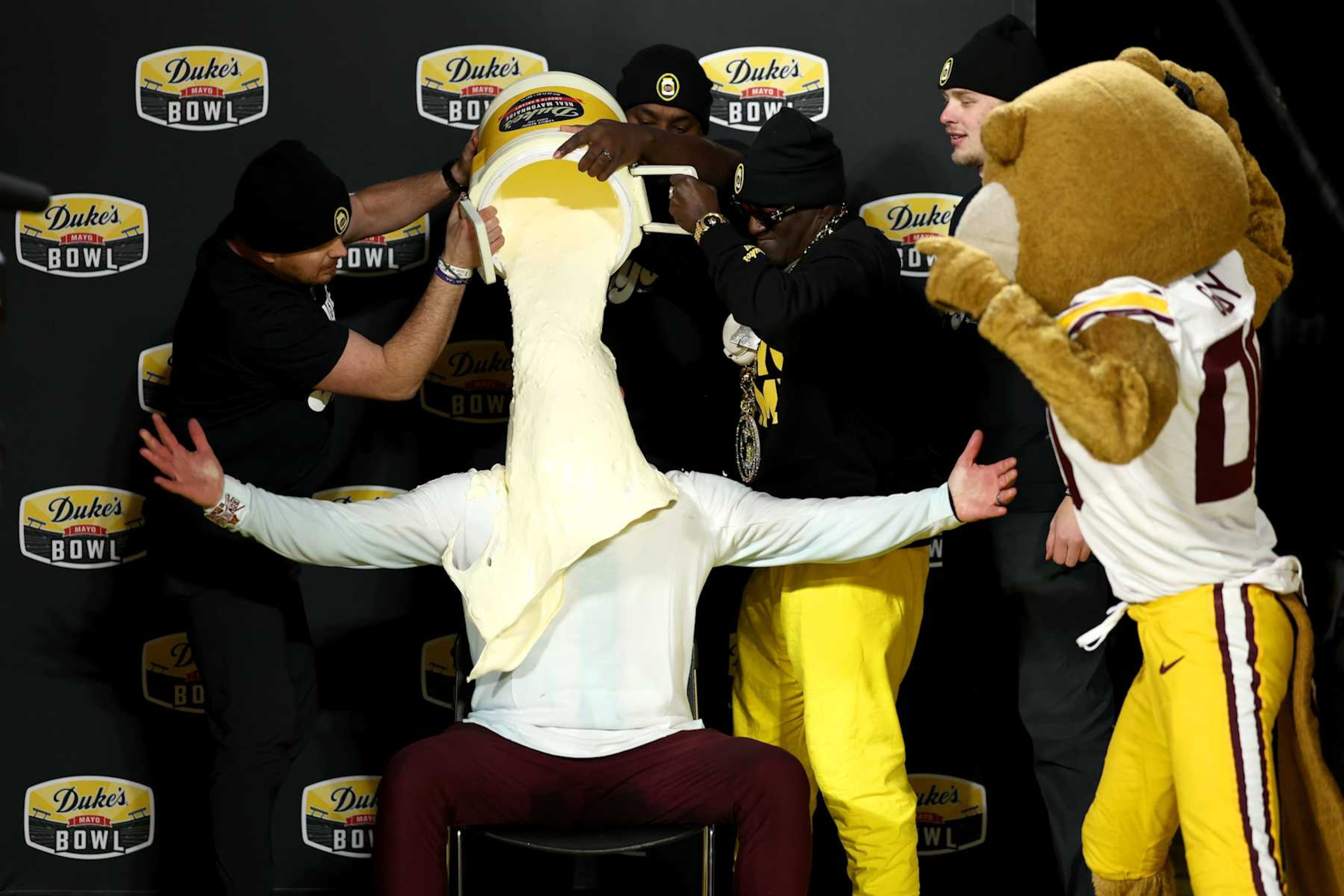 CHARLOTTE, NORTH CAROLINA - JANUARY 03: Head coach P.J. Fleck of the Minnesota Golden Gophers gets a mayo bath after winning the Duke's Mayo Bowl against the Virginia Tech Hokies at Bank of America Stadium on January 03, 2025 in Charlotte, North Carolina. (Photo by Jared C. Tilton/Getty Images) CHARLOTTE, NORTH CAROLINA - JANUARY 03: Head coach P.J. Fleck of the Minnesota Golden Gophers gets a mayo bath after winning the Duke's Mayo Bowl against the Virginia Tech Hokies at Bank of America Stadium on January 03, 2025 in Charlotte, North Carolina. (Photo by Jared C. Tilton/Getty Images)