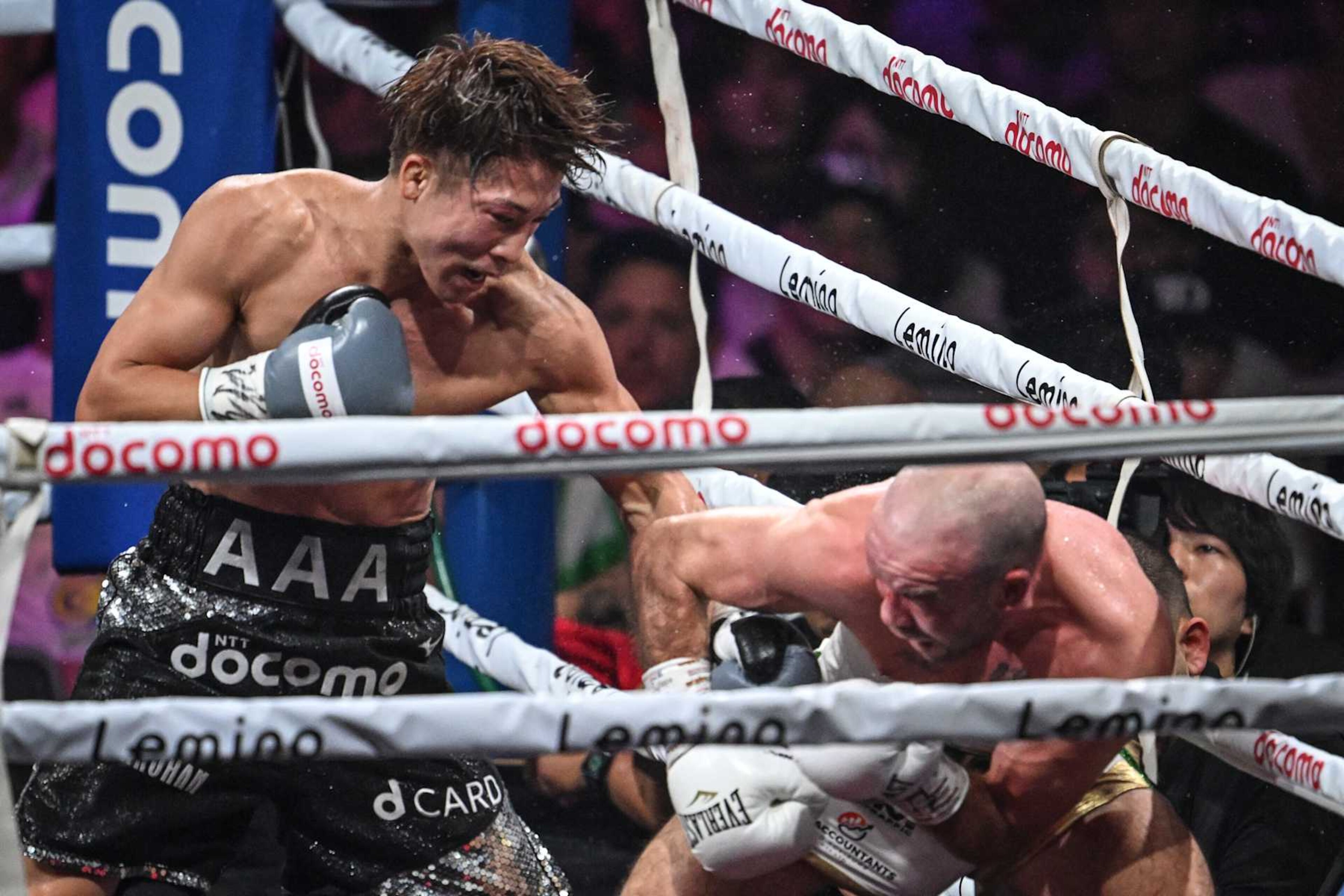 Japan's Naoya Inoue (L) and Ireland's TJ Doheny fight during their IBF-WBA-WBC-WBO super-bantamweight title boxing match at at Ariake Arena in Tokyo on September 3, 2024. (Photo by Yuichi YAMAZAKI / AFP) (Photo by YUICHI YAMAZAKI/AFP via Getty Images)