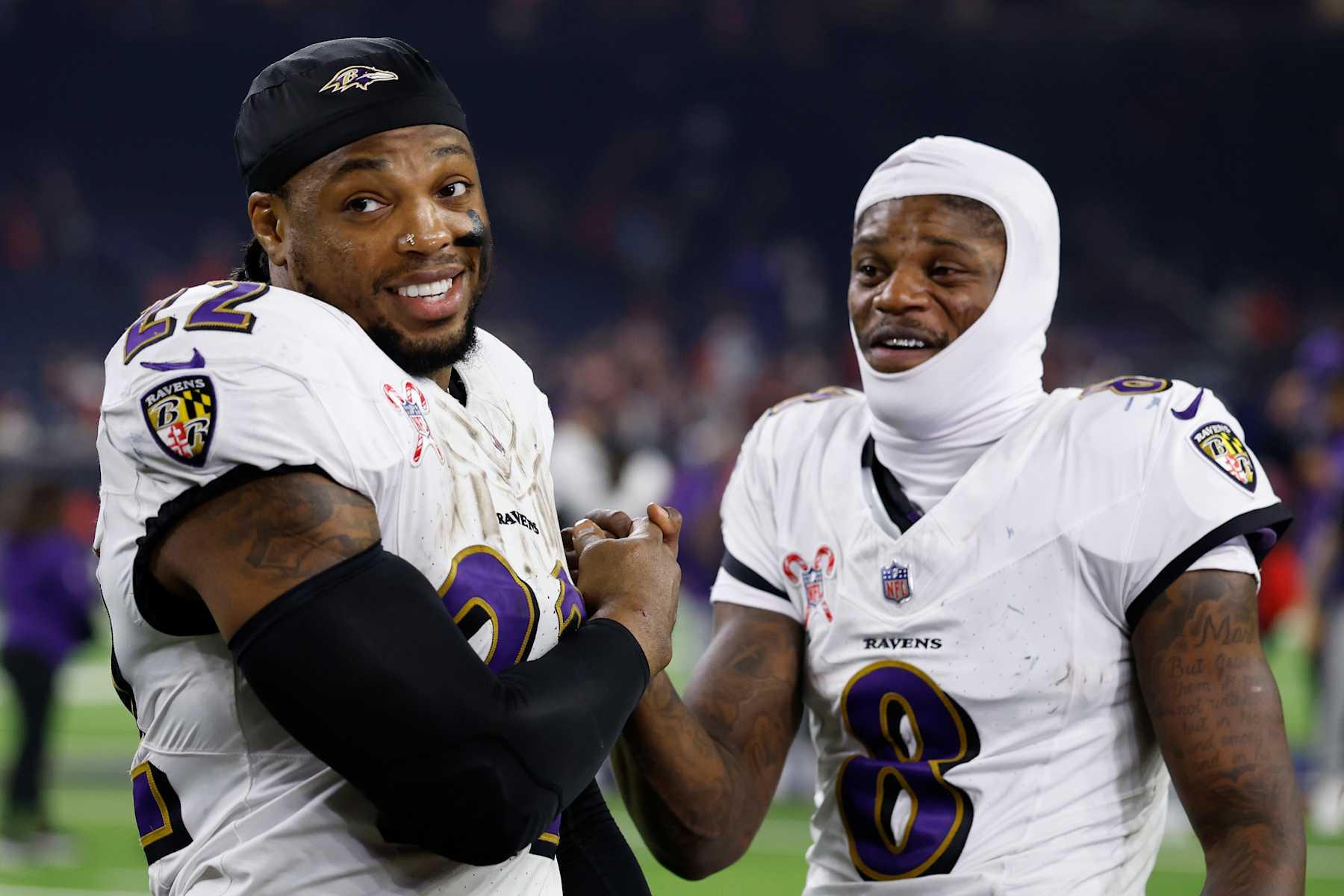 HOUSTON, TEXAS - DECEMBER 25: Derrick Henry #22 and Lamar Jackson #8 of the Baltimore Ravens celebrates after the win over the Houston Texans at NRG Stadium on December 25, 2024 in Houston, Texas. (Photo by Tim Warner/Getty Images)