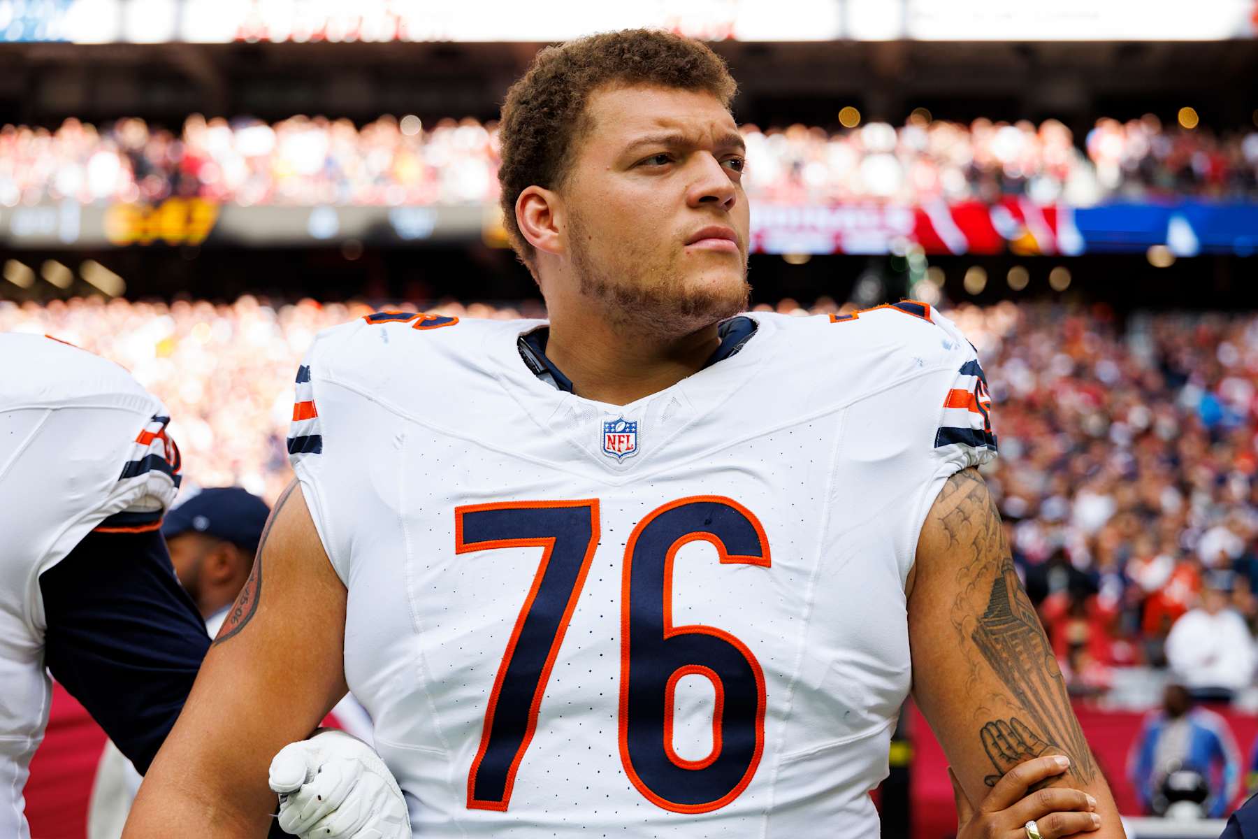 GLENDALE, ARIZONA - NOVEMBER 3: Guard Teven Jenkins #76 of the Chicago Bears stands on the sidelines during the national anthem prior to an NFL football game against the Arizona Cardinals, at State Farm Stadium on November 3, 2024 in Glendale, Arizona. (Photo by Brooke Sutton/Getty Images)