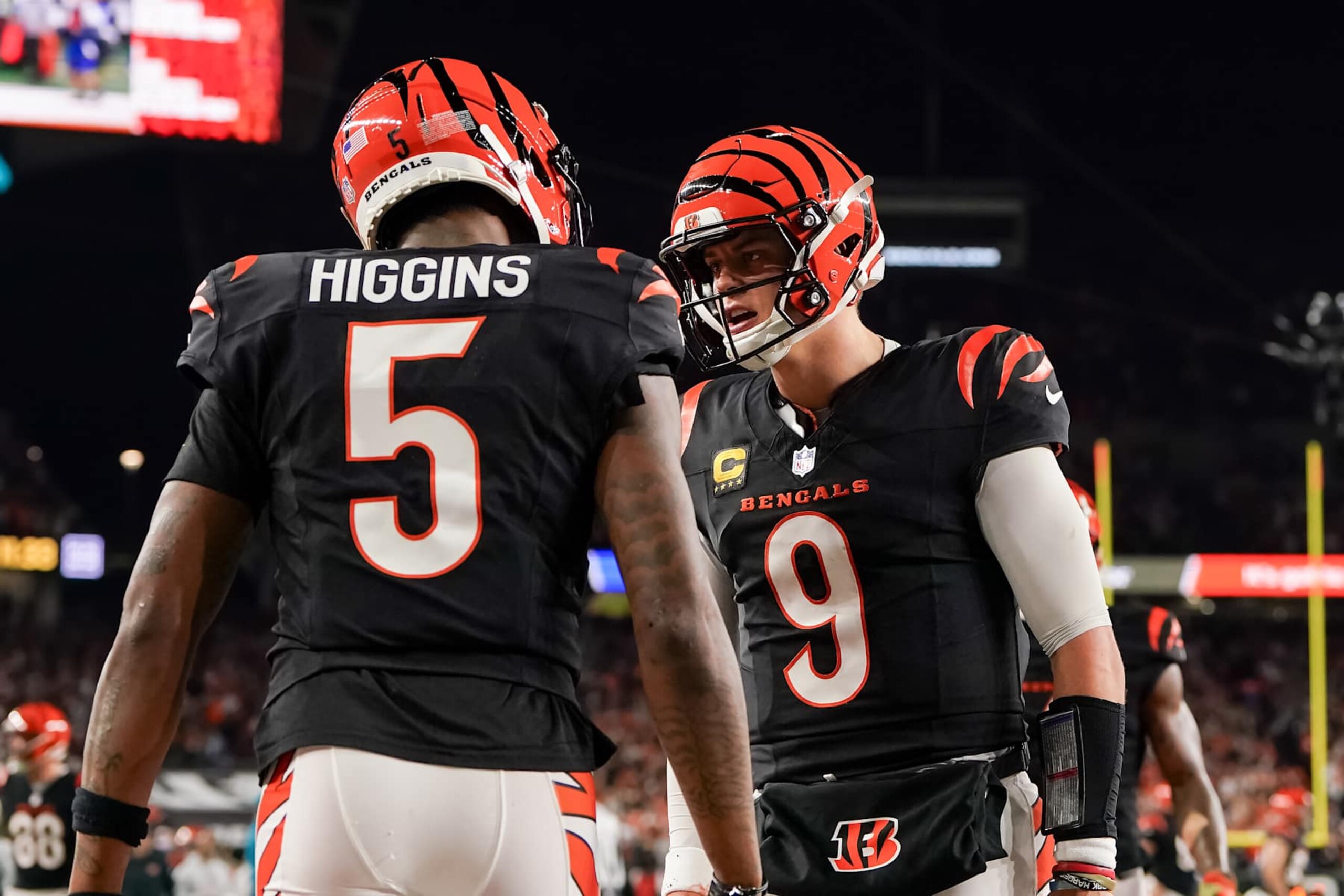 CINCINNATI, OHIO - DECEMBER 28: Tee Higgins #5 and Joe Burrow #9 of the Cincinnati Bengals celebrate after scoring a touchdown in the fourth quarter against the Denver Broncos at Paycor Stadium on December 28, 2024 in Cincinnati, Ohio. (Photo by Dylan Buell/Getty Images) CINCINNATI, OHIO - DECEMBER 28: Tee Higgins #5 and Joe Burrow #9 of the Cincinnati Bengals celebrate after scoring a touchdown in the fourth quarter against the Denver Broncos at Paycor Stadium on December 28, 2024 in Cincinnati, Ohio. (Photo by Dylan Buell/Getty Images)