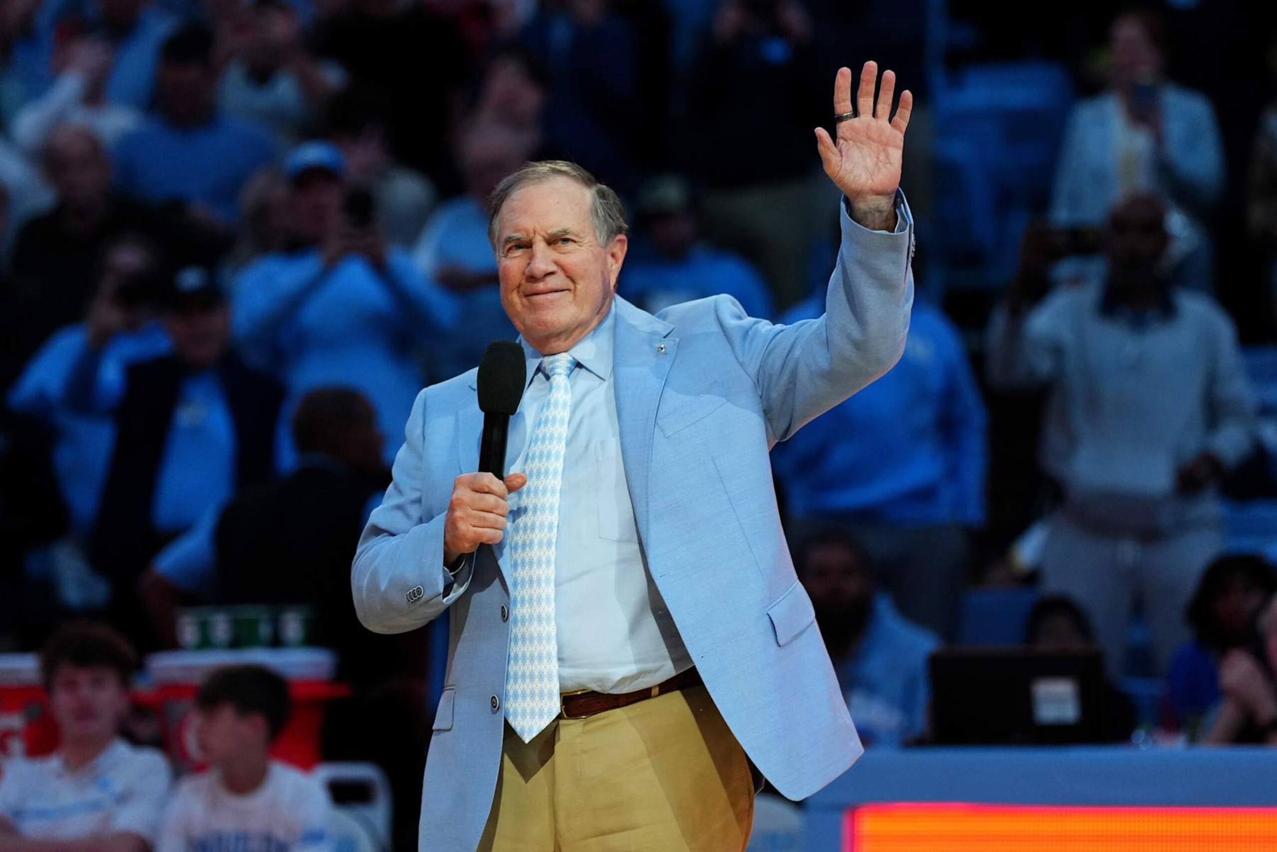 CHAPEL HILL, NORTH CAROLINA - DECEMBER 14: Head coach Bill Belichick of the North Carolina Tar Heels addresses the crowd during halftime in the game against the La Salle Explorers at the Dean E. Smith Center on December 14, 2024 in Greensboro, North Carolina. (Photo by Grant Halverson/Getty Images) CHAPEL HILL, NORTH CAROLINA - DECEMBER 14: Head coach Bill Belichick of the North Carolina Tar Heels addresses the crowd during halftime in the game against the La Salle Explorers at the Dean E. Smith Center on December 14, 2024 in Greensboro, North Carolina. (Photo by Grant Halverson/Getty Images)