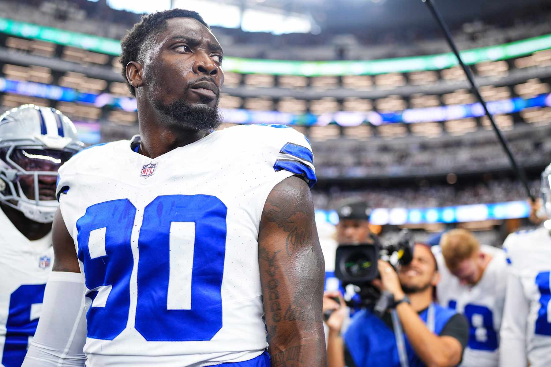ARLINGTON, TX - SEPTEMBER 22: DeMarcus Lawrence #90 of the Dallas Cowboys leads a huddle prior to an NFL football game against the Baltimore Ravens at AT&T Stadium on September 22, 2024 in Arlington, Texas. (Photo by Cooper Neill/Getty Images)