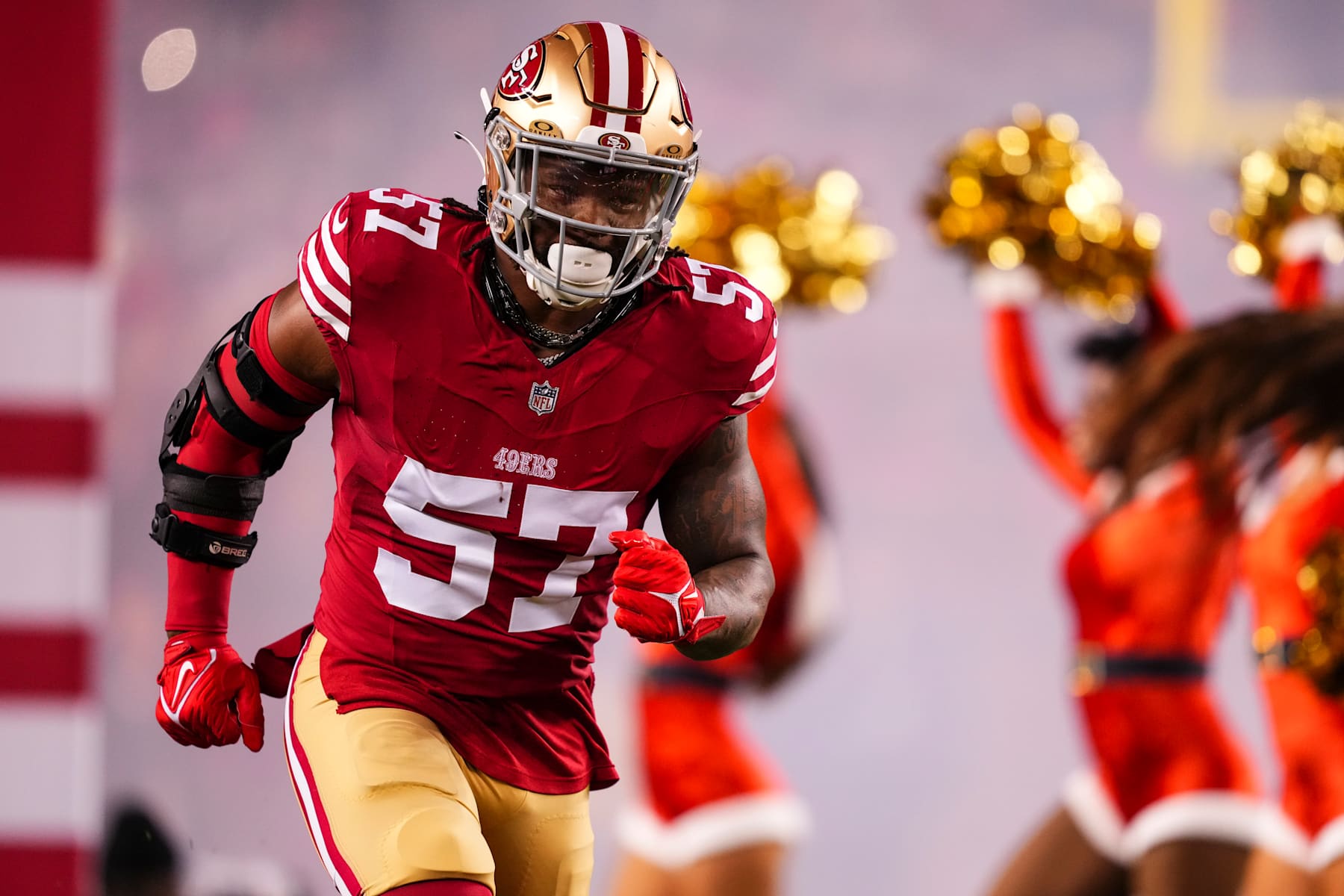 SANTA CLARA, CA - DECEMBER 12: Dre Greenlaw #57 of the San Francisco 49ers runs out of the tunnel prior to an NFL football game against the Los Angeles Rams at Levi's Stadium on December 12, 2024 in Santa Clara, California. (Photo by Cooper Neill/Getty Images)