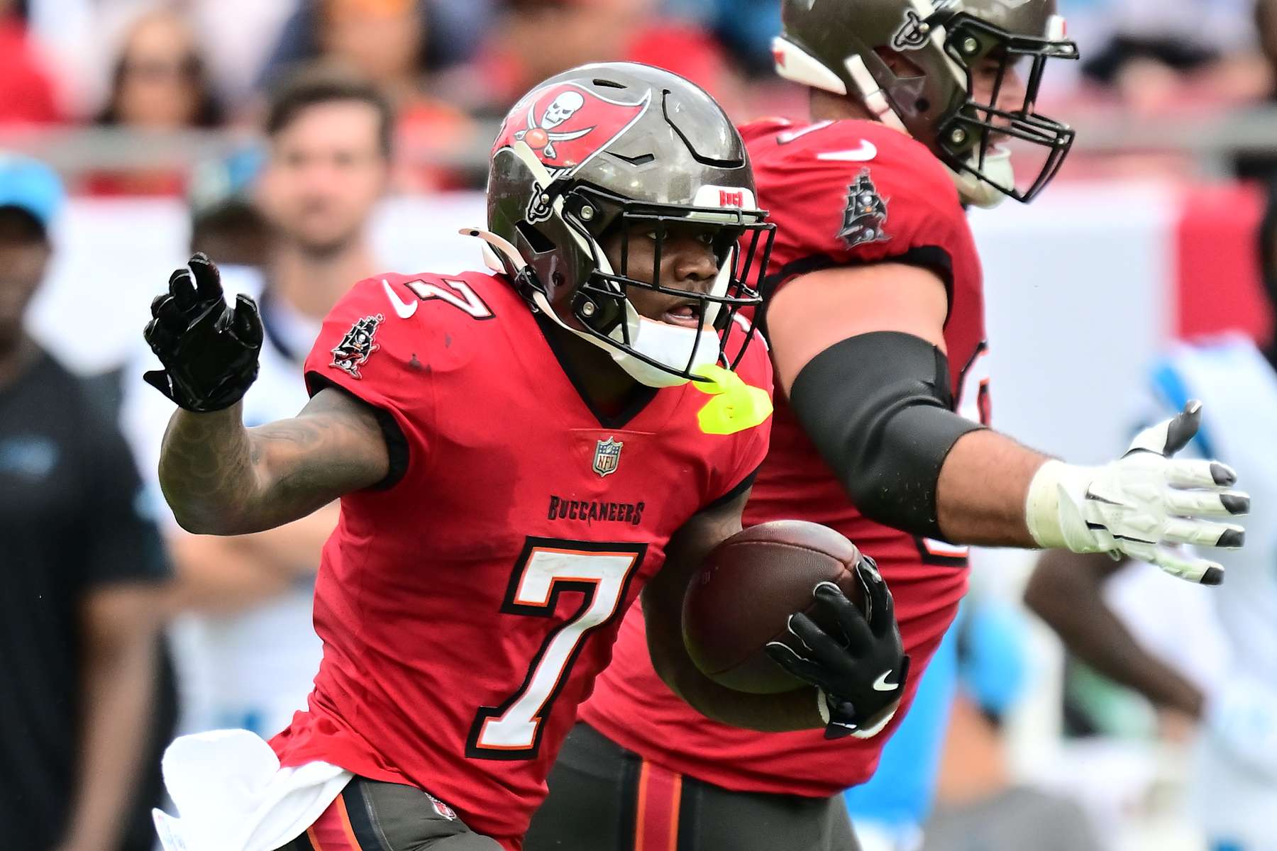 TAMPA, FLORIDA - DECEMBER 29: Bucky Irving #7 of the Tampa Bay Buccaneers carries the ball during the second quarter against the Carolina Panthers at Raymond James Stadium on December 29, 2024 in Tampa, Florida. (Photo by Julio Aguilar/Getty Images)