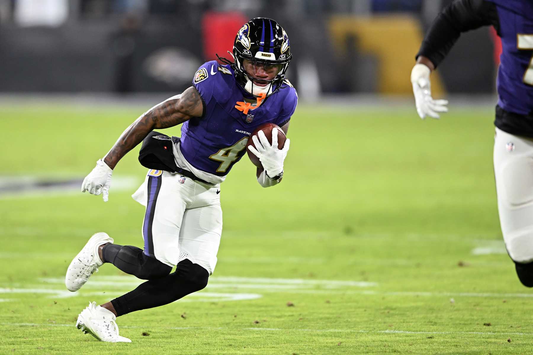 BALTIMORE, MARYLAND - JANUARY 04: Zay Flowers #4 of the Baltimore Ravens runs with the ball after a catch during the second quarter against the Cleveland Browns at M&T Bank Stadium on January 04, 2025 in Baltimore, Maryland. (Photo by Greg Fiume/Getty Images)