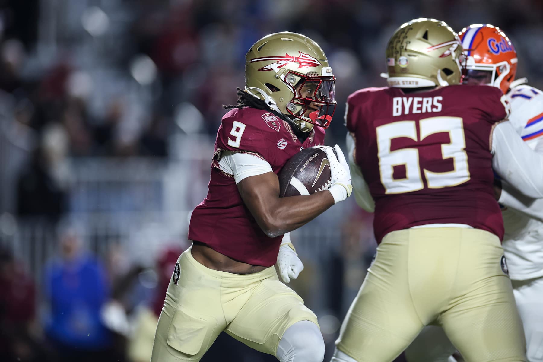 TALLAHASSEE, FLORIDA - NOVEMBER 30: Lawrance Toafili #9 of the Florida State Seminoles runs with the ball during the first half of a game against the Florida Gators at Doak Campbell Stadium on November 30, 2024 in Tallahassee, Florida. (Photo by James Gilbert/Getty Images)