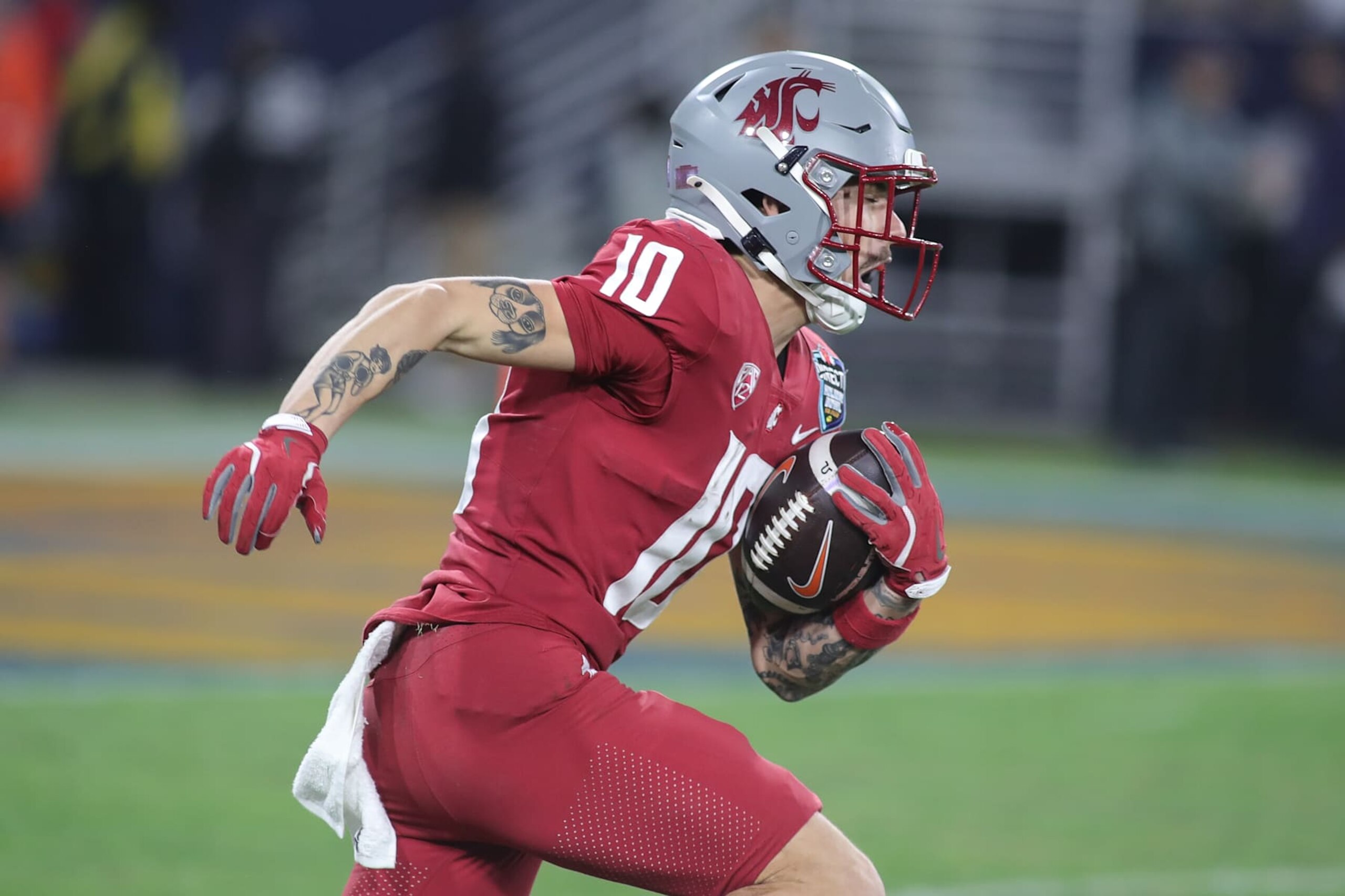 SAN DIEGO, CA - DECEMBER 27: Washington State Cougars quarterback John Mateer (10) runs a kickoff during the Syracuse Orange game versus the Washington State Cougars in the Holiday Bowl on December 27, 2024, at Snapdragon Stadium in San Diego, CA. (Photo by Jevone Moore/Icon Sportswire via Getty Images)