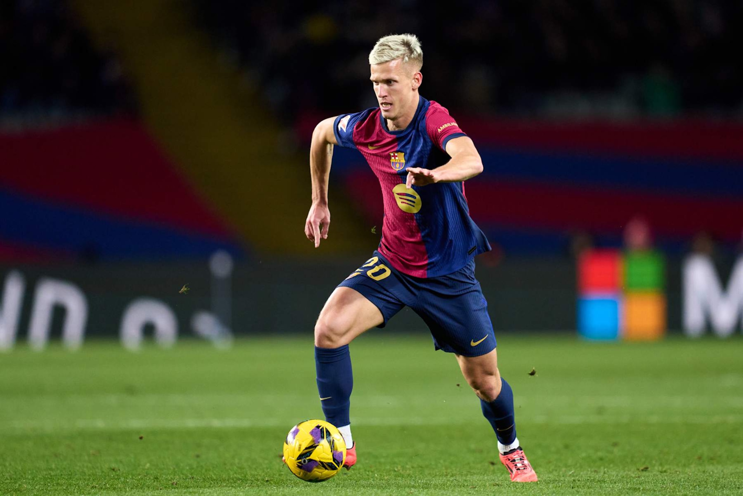 BARCELONA, SPAIN - DECEMBER 21: Dani Olmo of FC Barcelona runs with the ball during the LaLiga EASports match between FC Barcelona and Atletico de Madrid at Estadi Olimpic Lluis Companys on December 21, 2024 in Barcelona, Spain. (Photo by Alex Caparros/Getty Images)