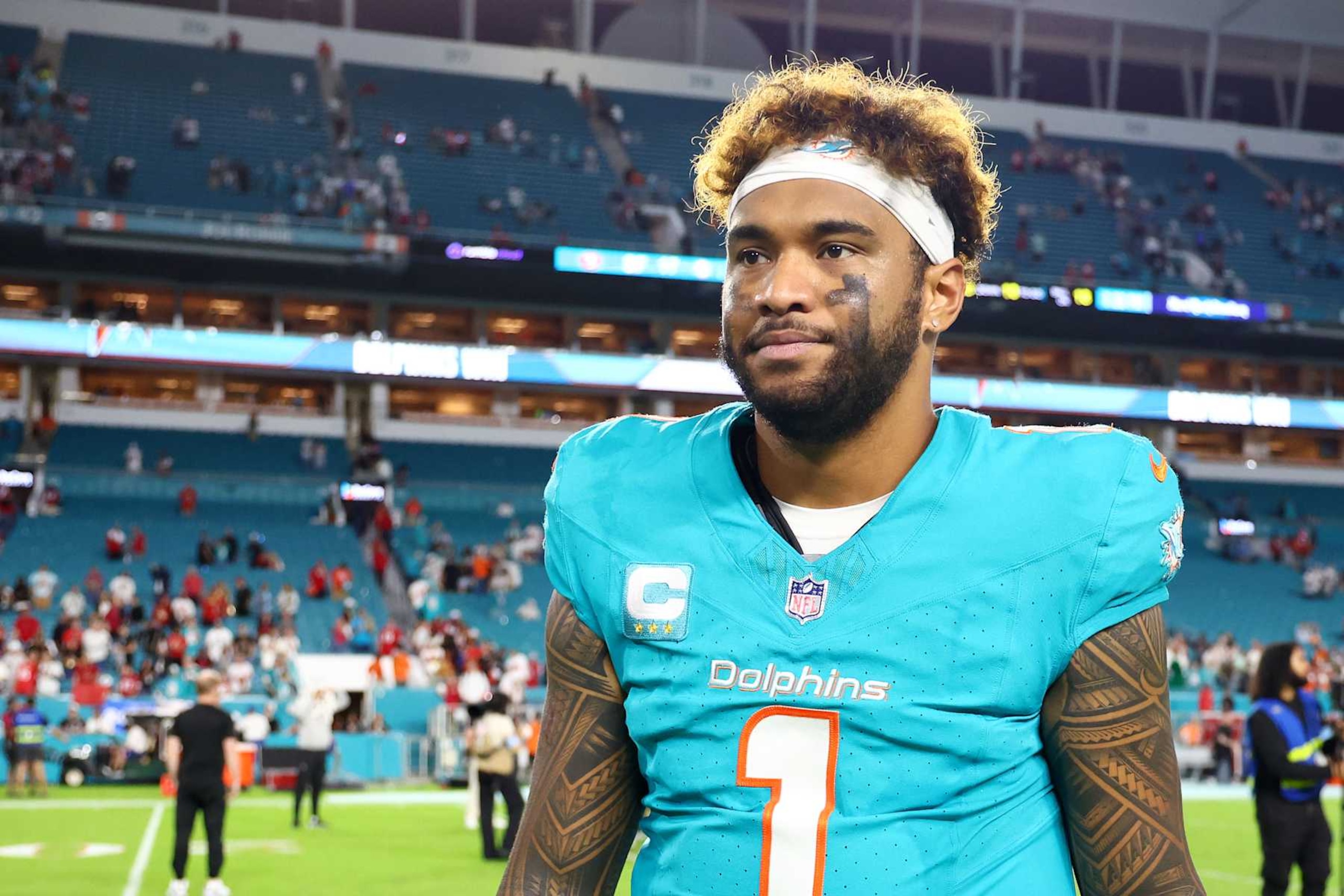 MIAMI GARDENS, FLORIDA - DECEMBER 22: Tua Tagovailoa #1 of the Miami Dolphins looks on after the 29-17 win against the San Francisco 49ers at Hard Rock Stadium on December 22, 2024 in Miami Gardens, Florida. (Photo by Megan Briggs/Getty Images) MIAMI GARDENS, FLORIDA - DECEMBER 22: Tua Tagovailoa #1 of the Miami Dolphins looks on after the 29-17 win against the San Francisco 49ers at Hard Rock Stadium on December 22, 2024 in Miami Gardens, Florida. (Photo by Megan Briggs/Getty Images)